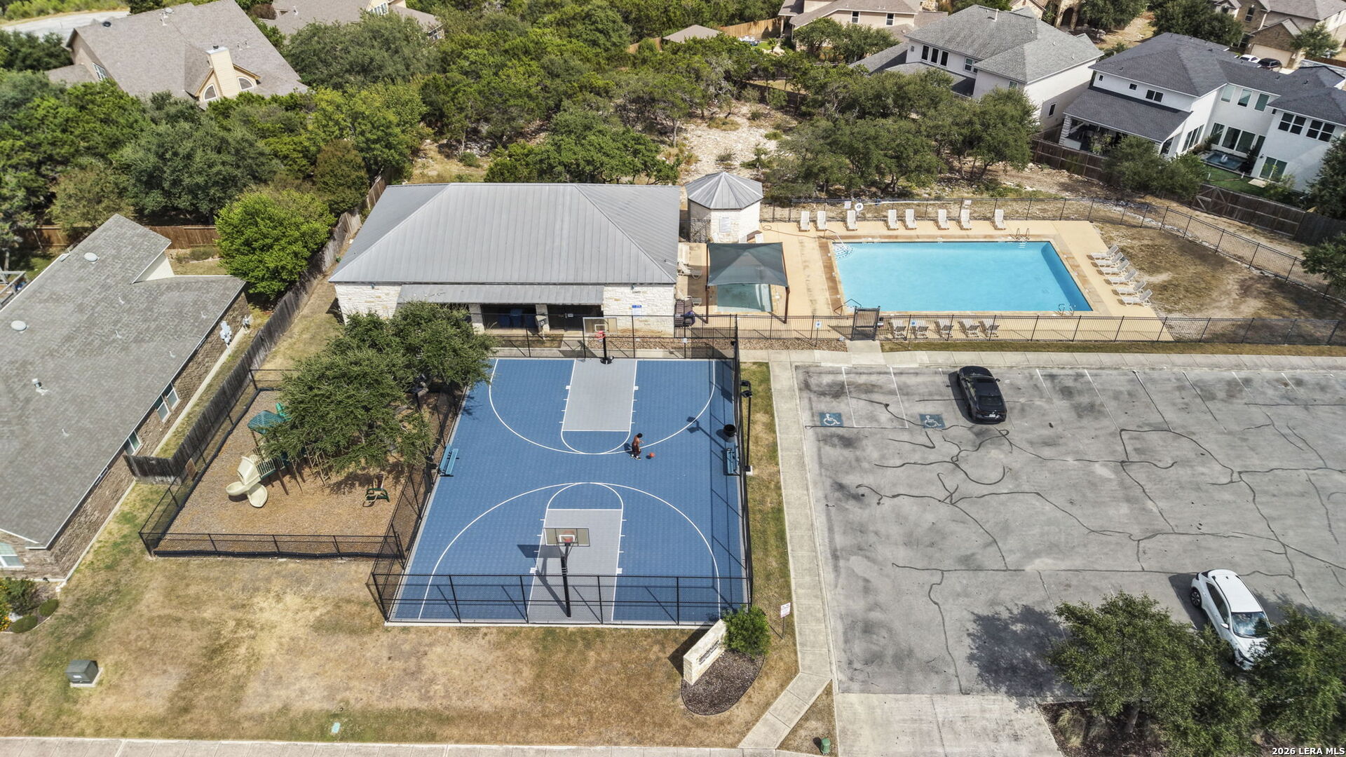 Community amenities with a swimming pool, basketball court, clubhouse, and playground.
