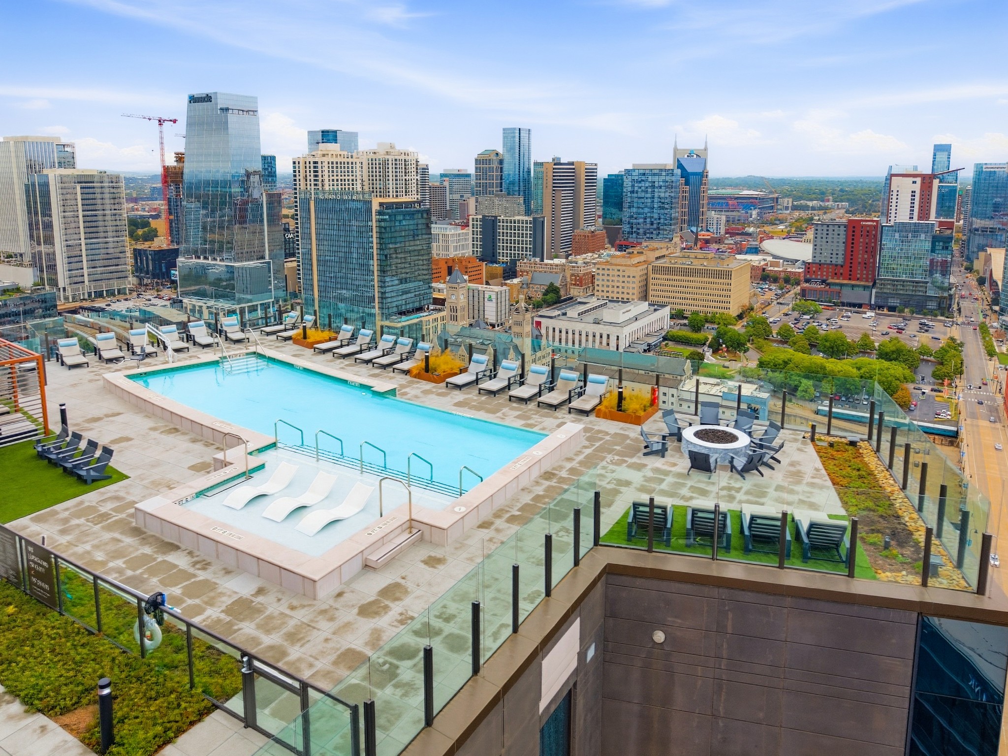 Rooftop pool and lounge deck overlooking downtown Nashville’s skyline.