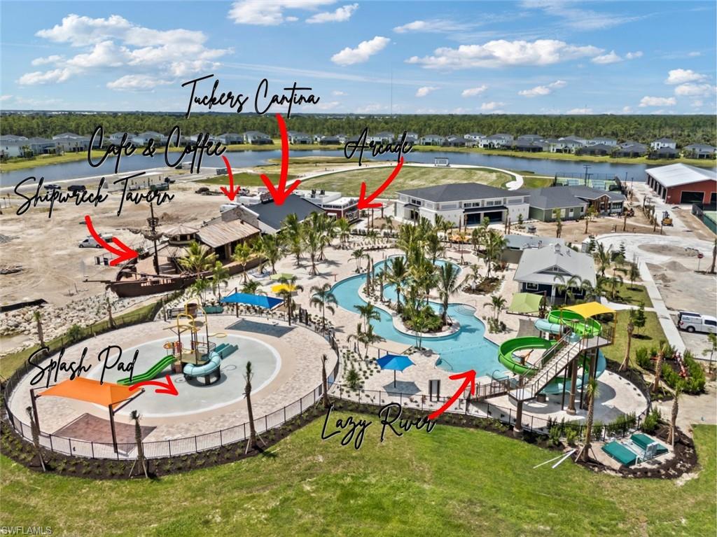 Aerial view of a community pool complex with a lazy river, waterslides, and labeled amenities.