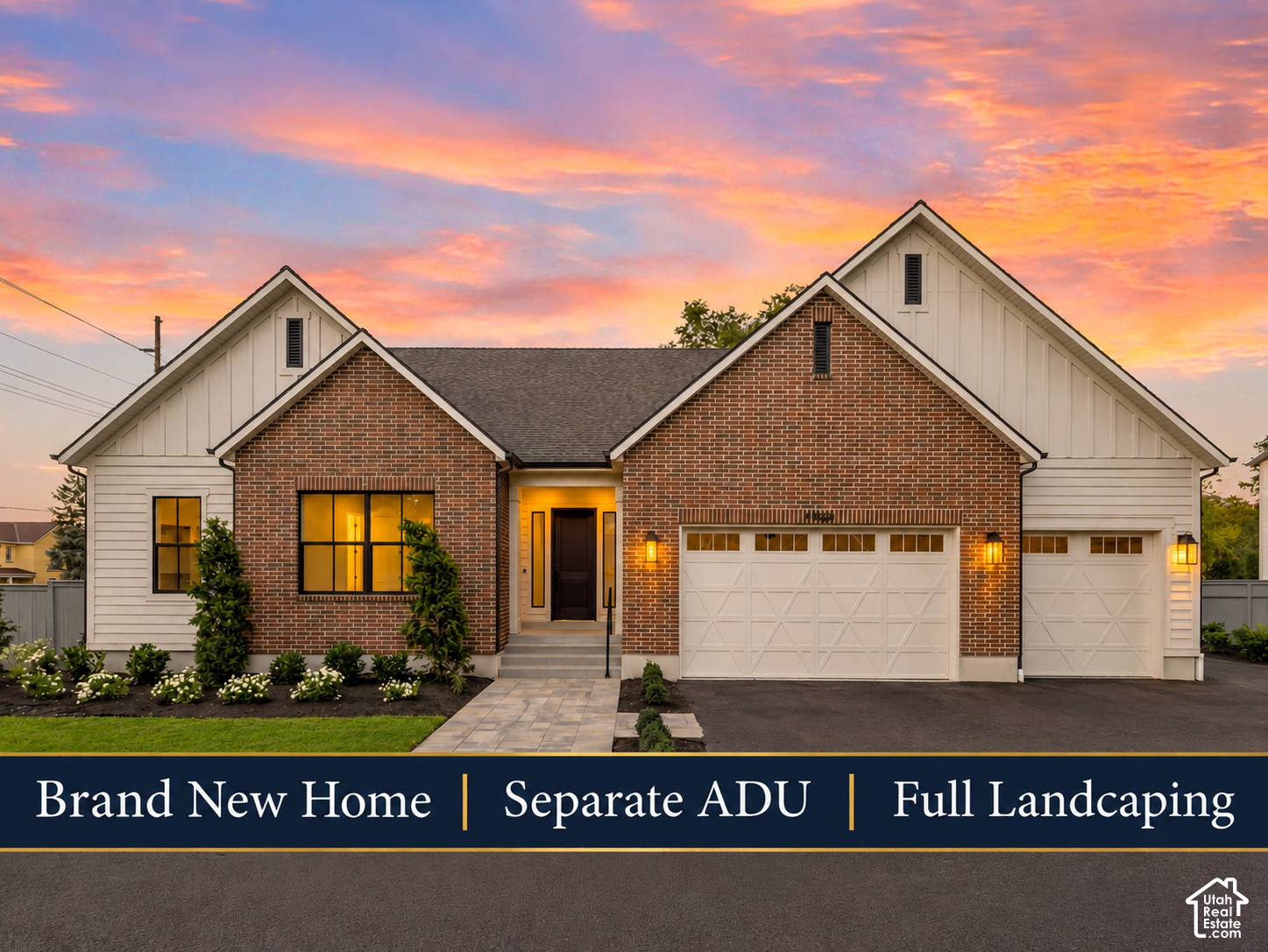 New brick-and-siding home with a three-car garage and landscaped yard beneath a colorful sunset.