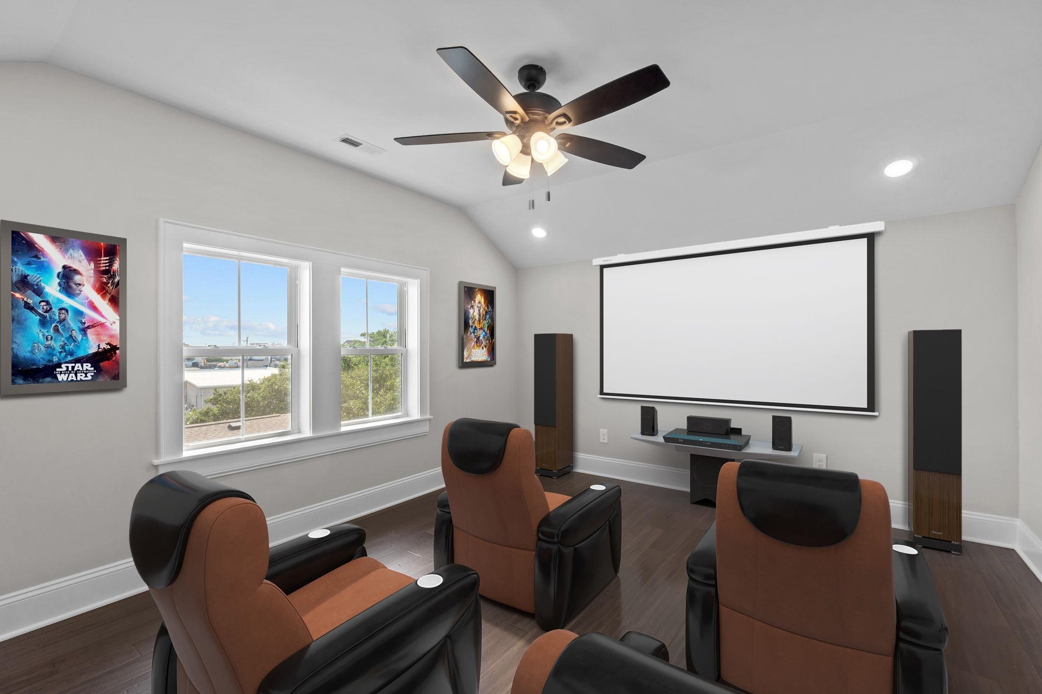 Home theater with recliners, a large projection screen, surround-sound speakers, and Star Wars posters.