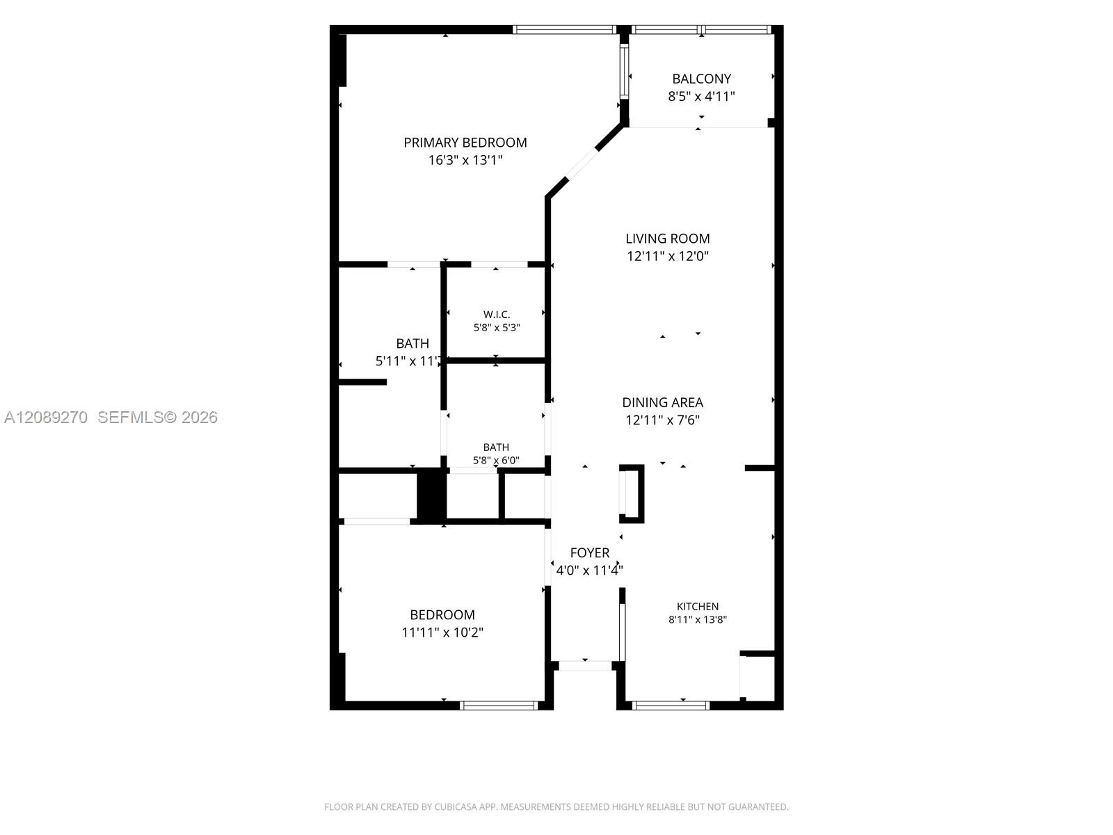 Two-bedroom condo floor plan with two baths, a walk-in closet, open living and dining areas, and a balcony.