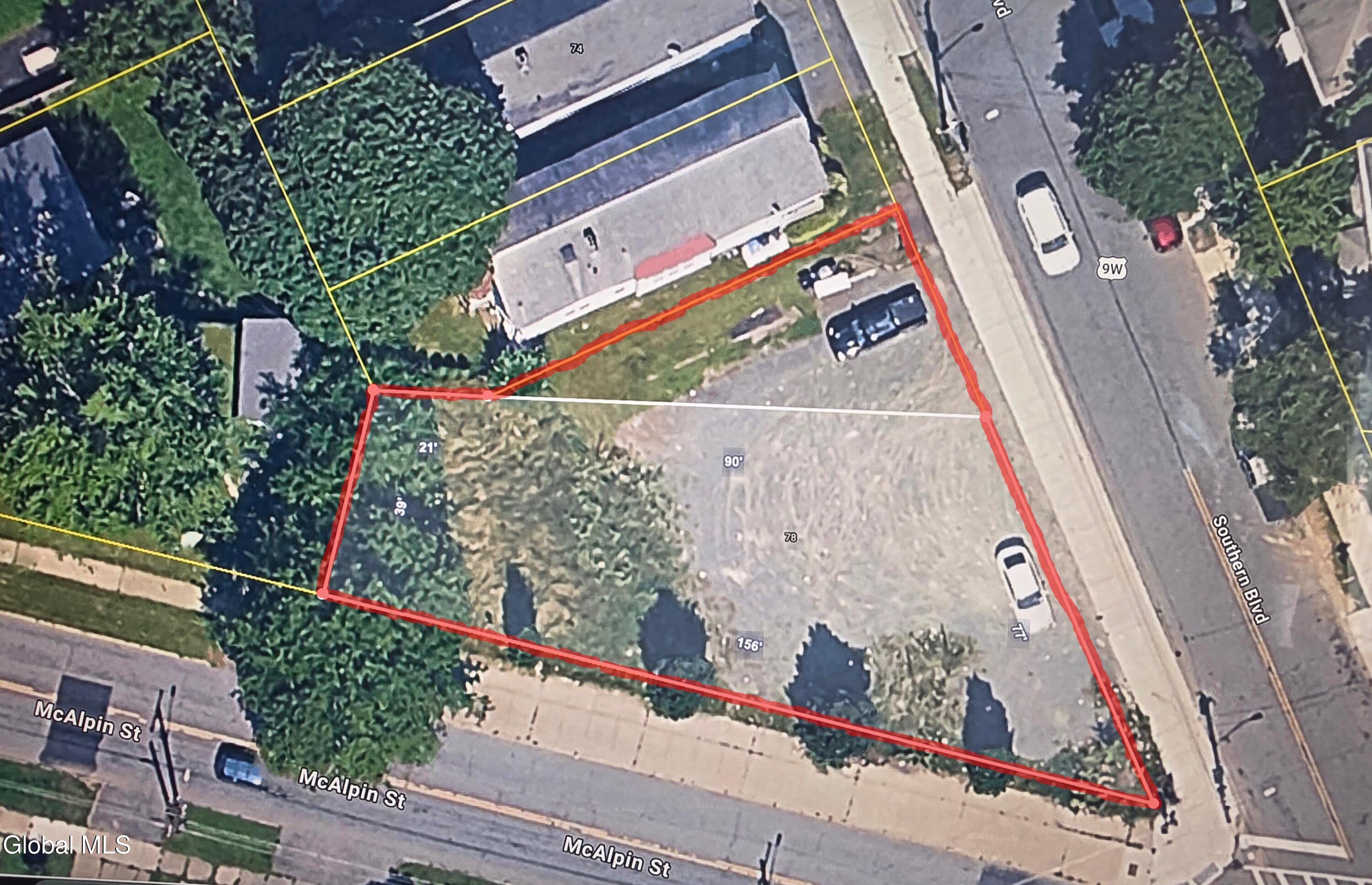 Aerial view of the vacant 78 Southern Boulevard lot outlined in red at the corner of McAlpin Street.