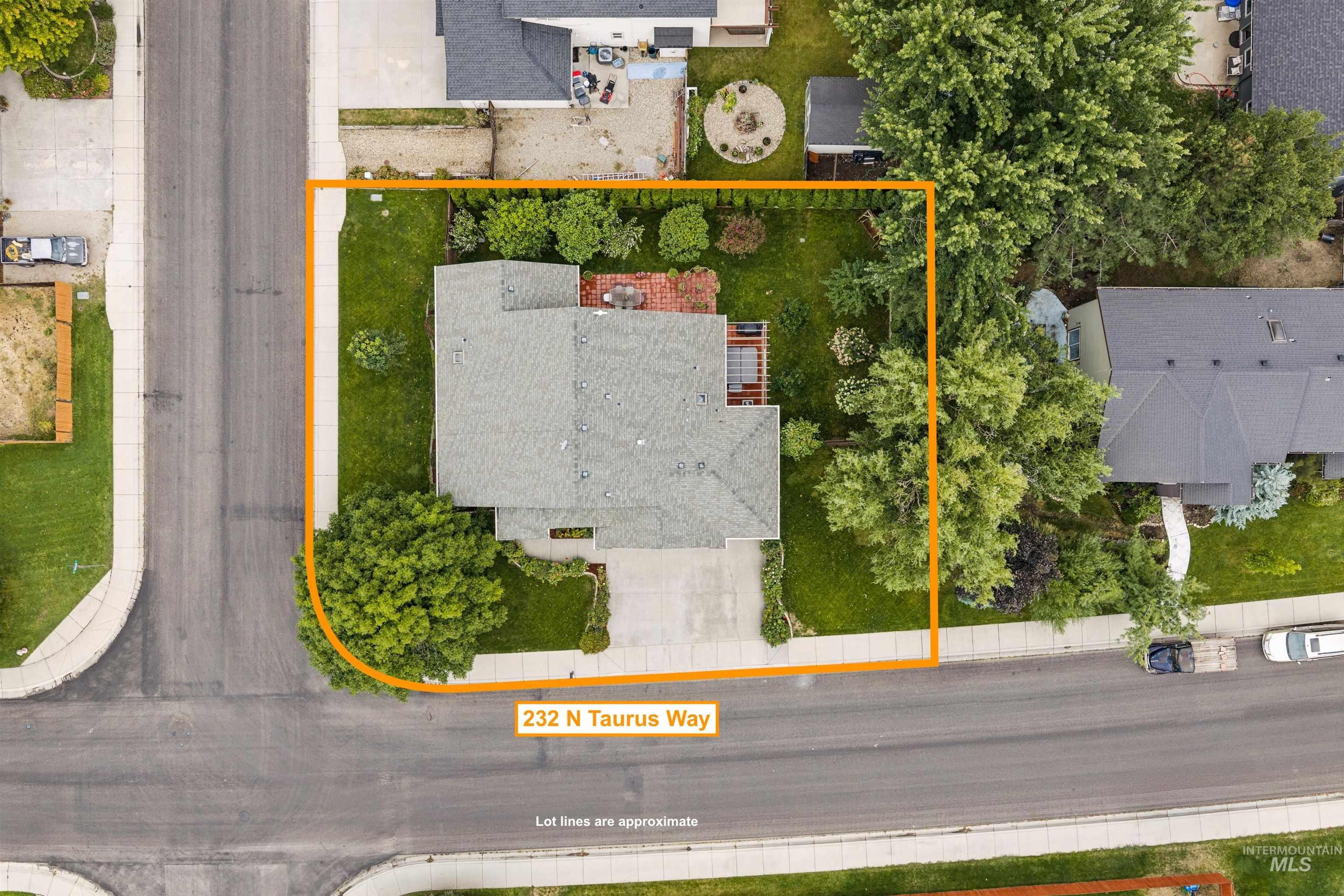 Aerial view of 232 N Taurus Way outlined in orange, showing the home, landscaped yard, and approximate lot lines.