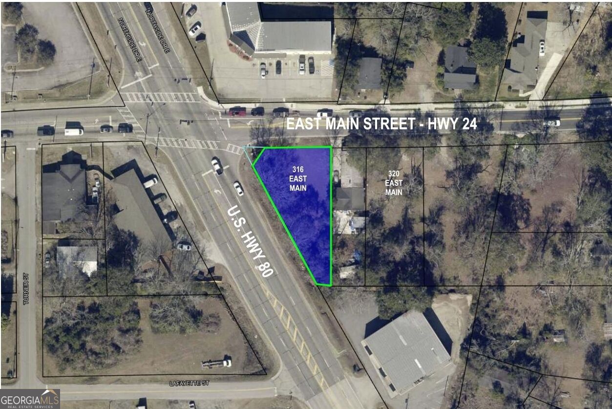 Aerial parcel map highlighting 316 East Main in blue at the intersection of East Main Street and U.S. Highway 80.