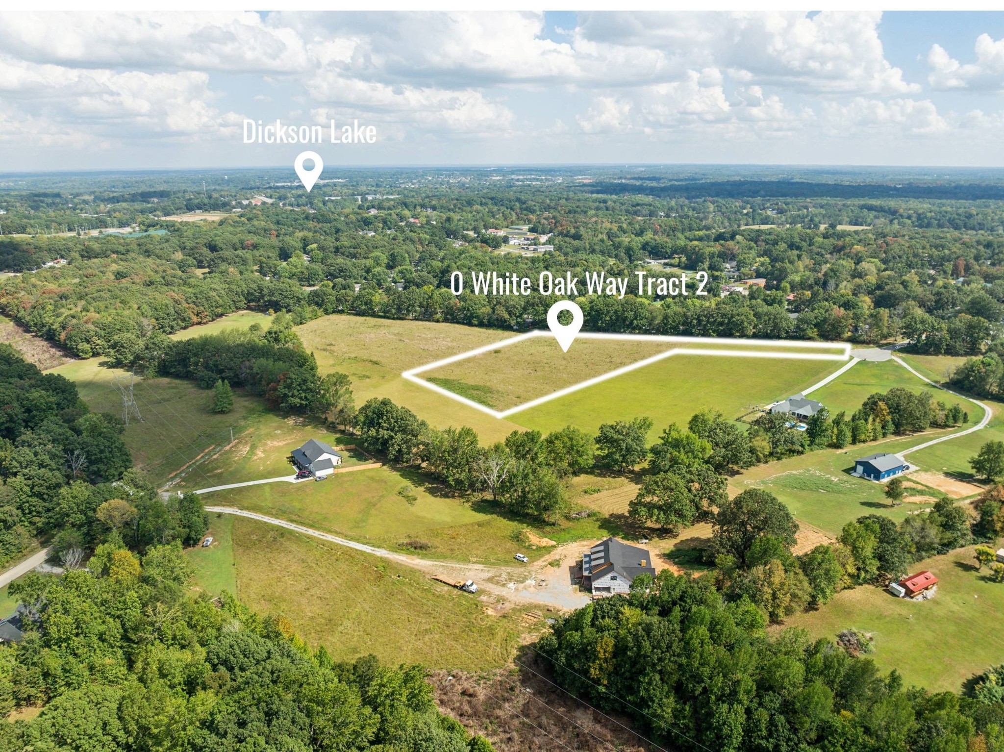 Aerial view of the outlined White Oak Way tract, an open grassy parcel surrounded by trees and nearby homes.