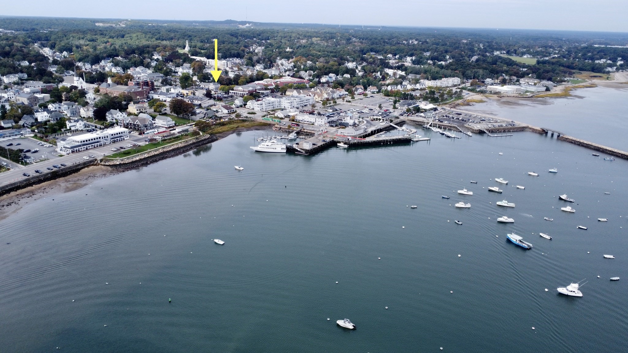 Aerial view of 12–14 N Park Ave, marked by a yellow arrow near Plymouth Harbor and marina.