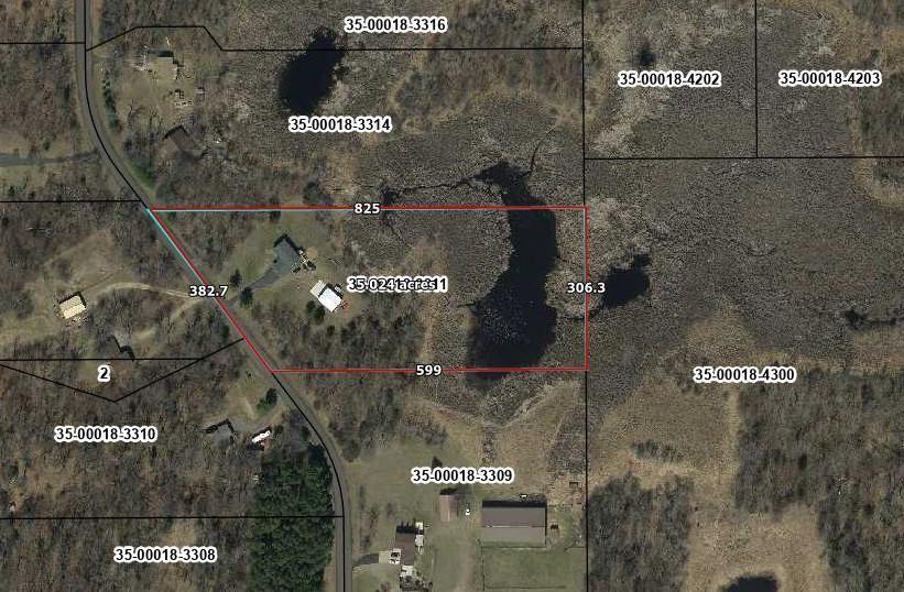 Aerial view of a 35-acre wooded property with a pond, outlined in red.