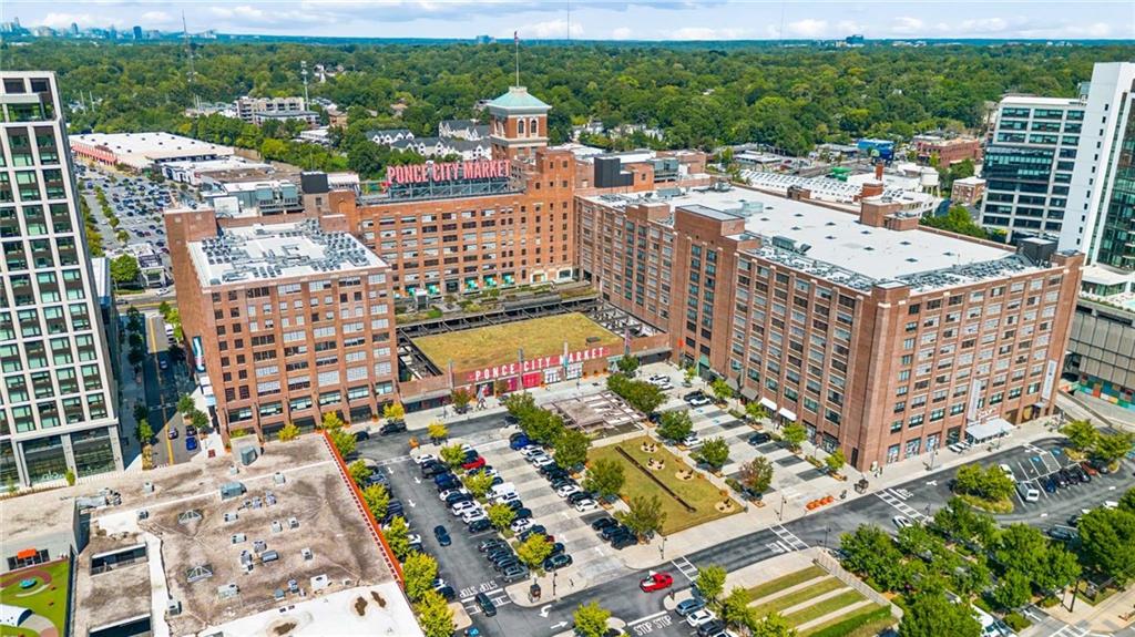 Aerial view of Ponce City Market and surrounding Atlanta buildings and tree canopy.