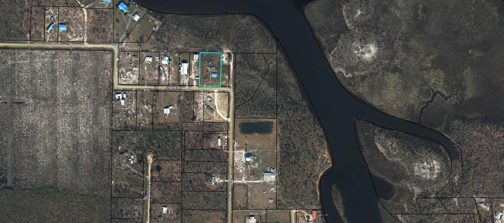 Aerial view of the outlined property parcel near Chapel Lane and a river.
