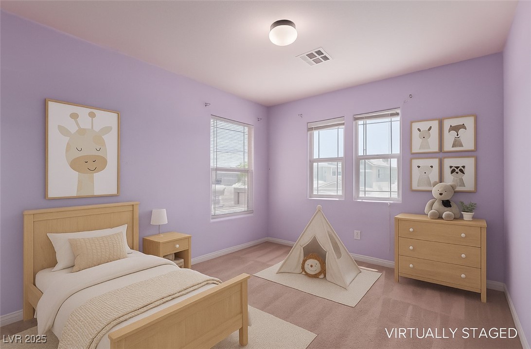 Bedroom with lavender walls, light wood furniture, animal artwork, and a small play tent.