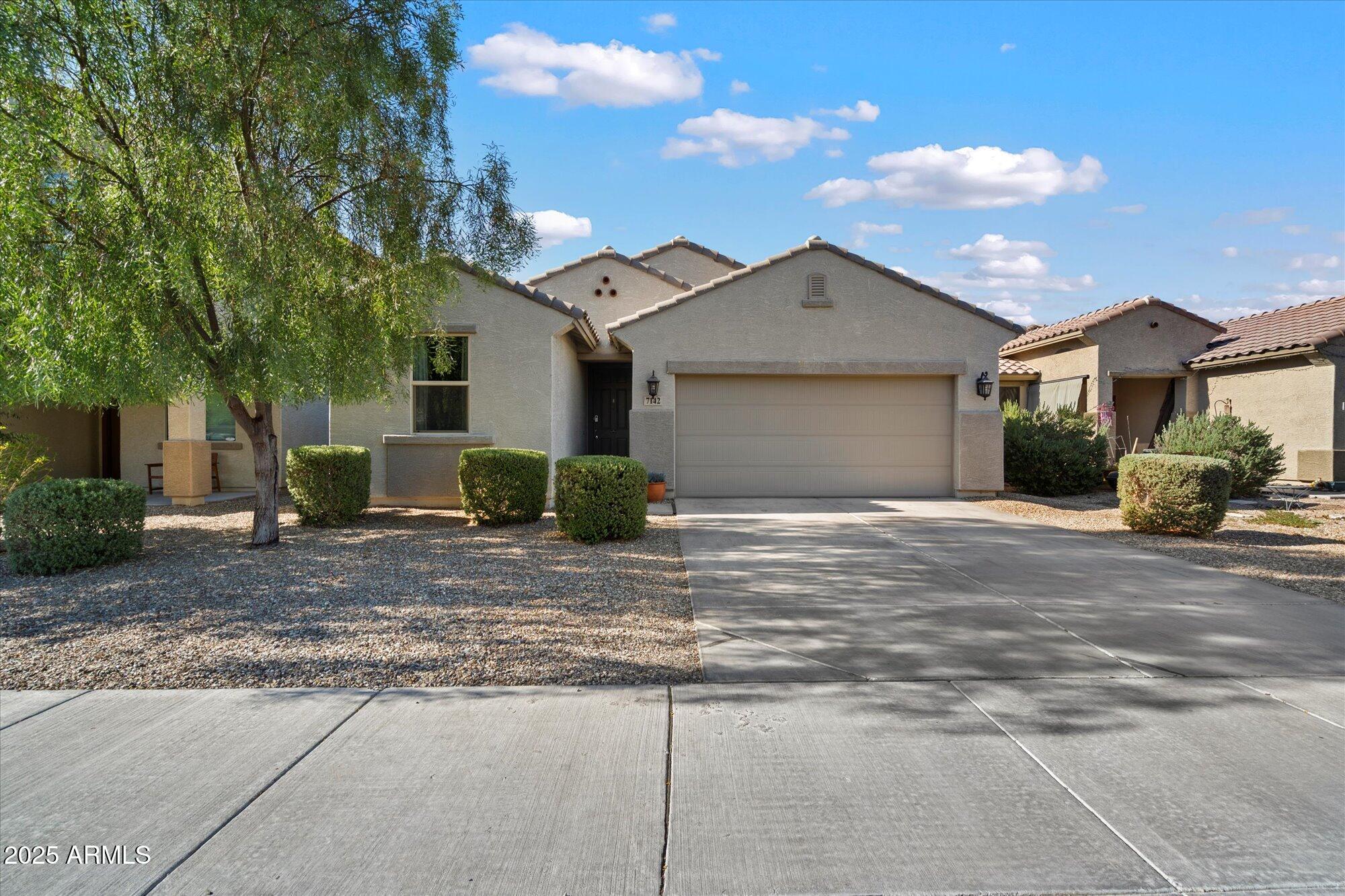 7142 W LAWRENCE Lane