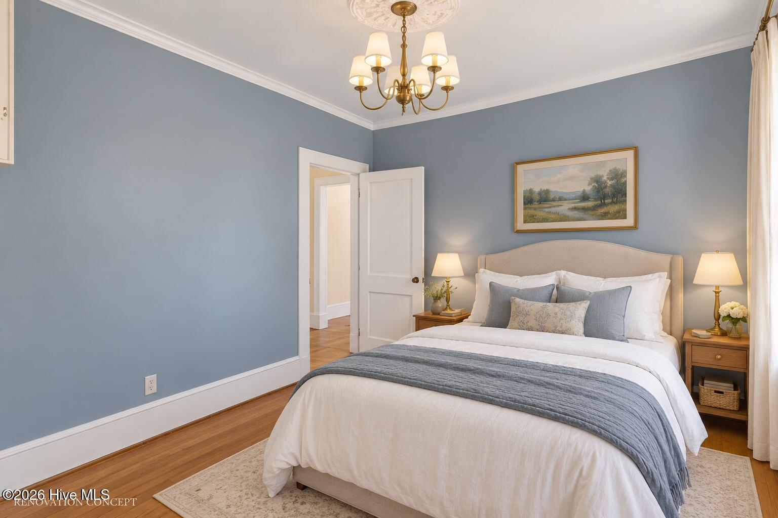 Furnished bedroom with blue-gray walls, a king bed, brass chandelier, and framed landscape painting.