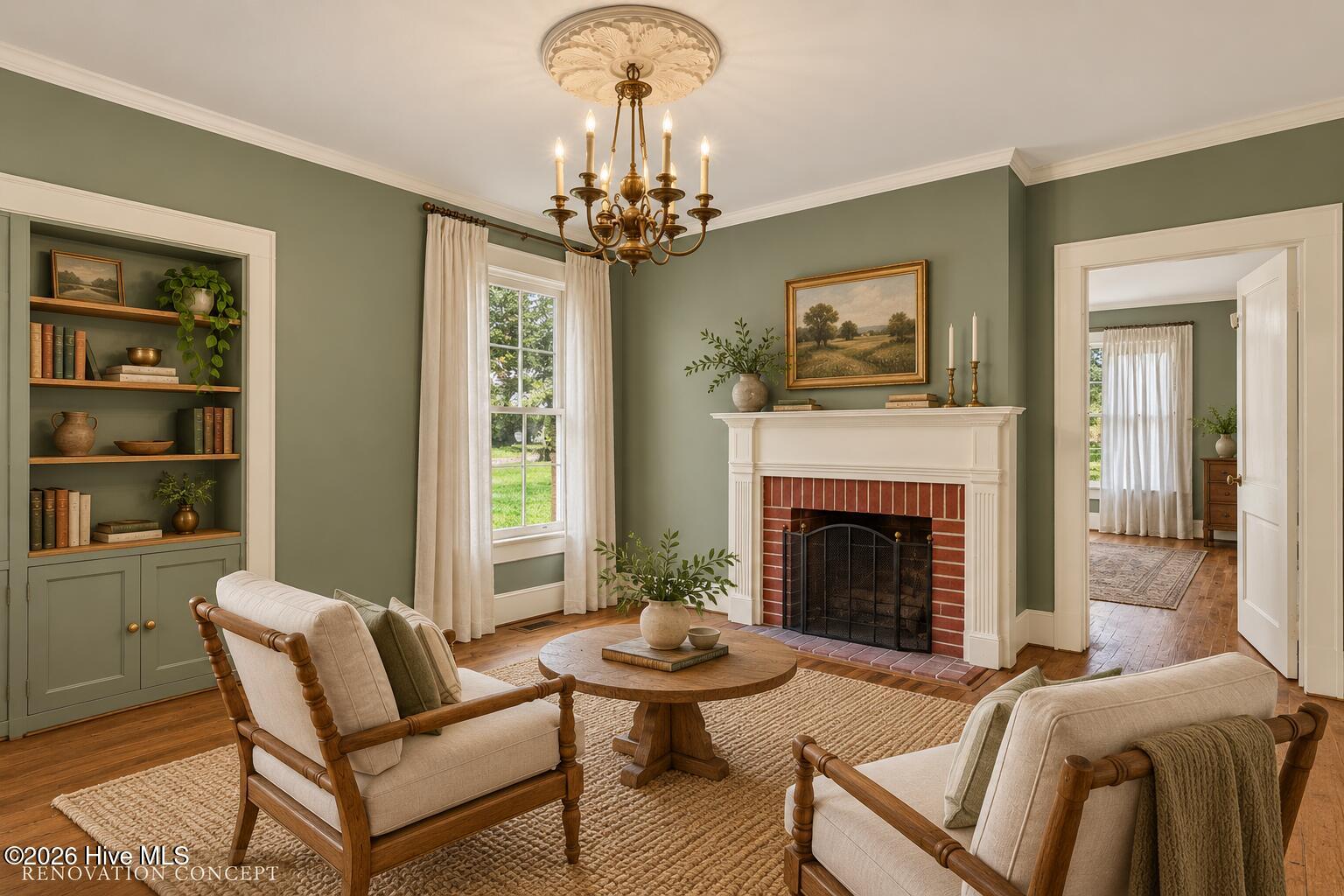 Living room with brick fireplace, built-in bookshelves, sage-green walls, and a brass chandelier.
