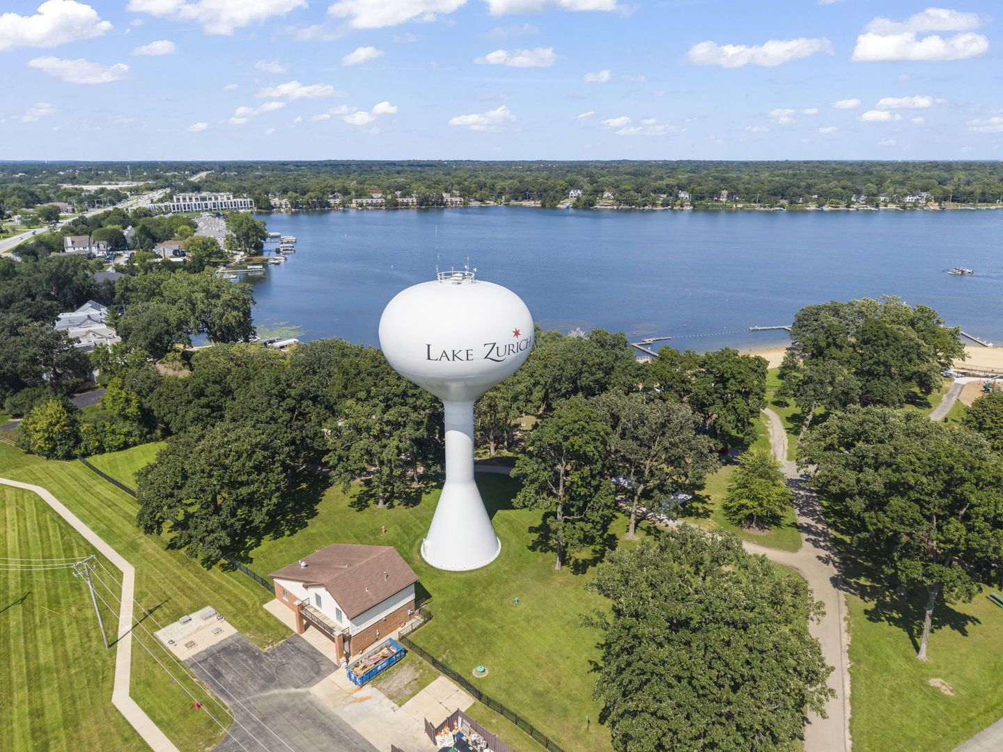 Aerial view of Lake Zurich with the town water tower in the foreground.