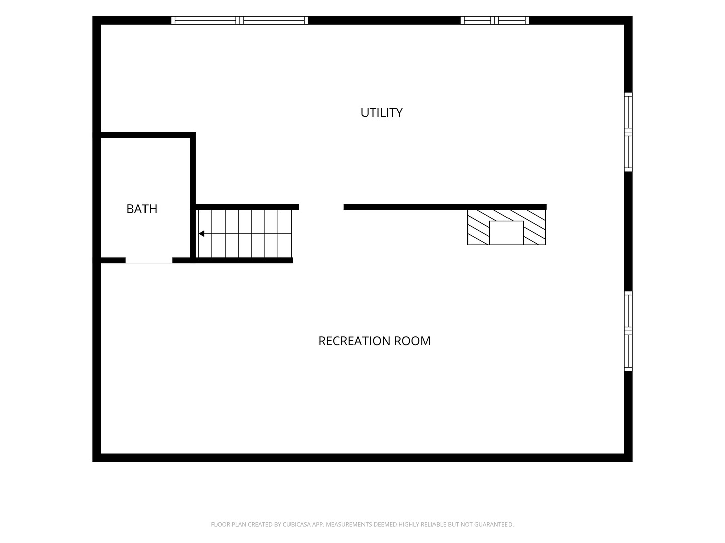 Basement floor plan with a recreation room, utility area, bathroom, staircase, and fireplace.