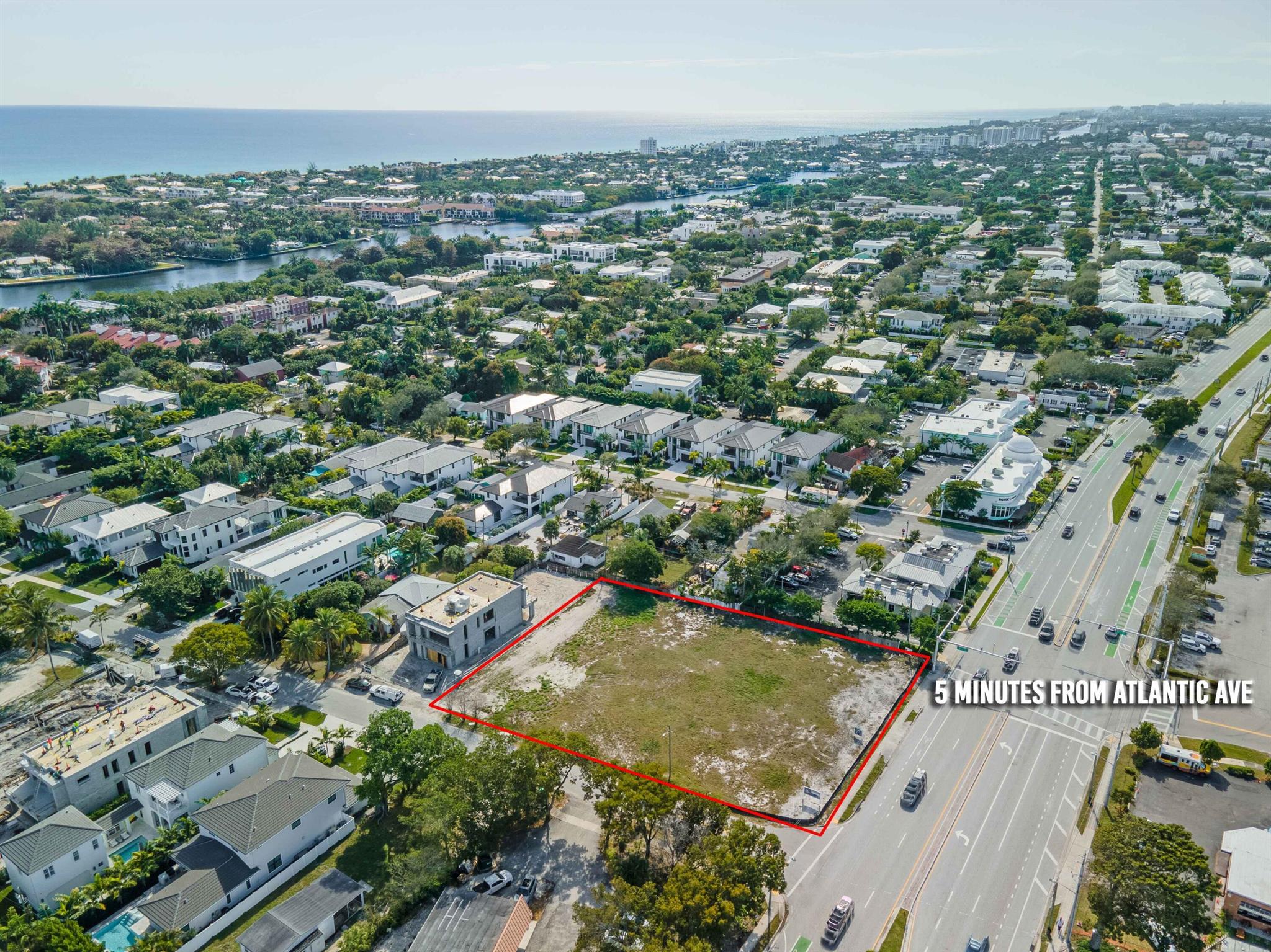 Medium-distance aerial view of the vacant lot at 1405 N Federal Highway, Delray Beach, outlined in red, located in a high-growth luxury corridor.