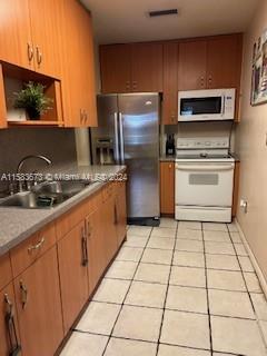 1275 NE 204th St