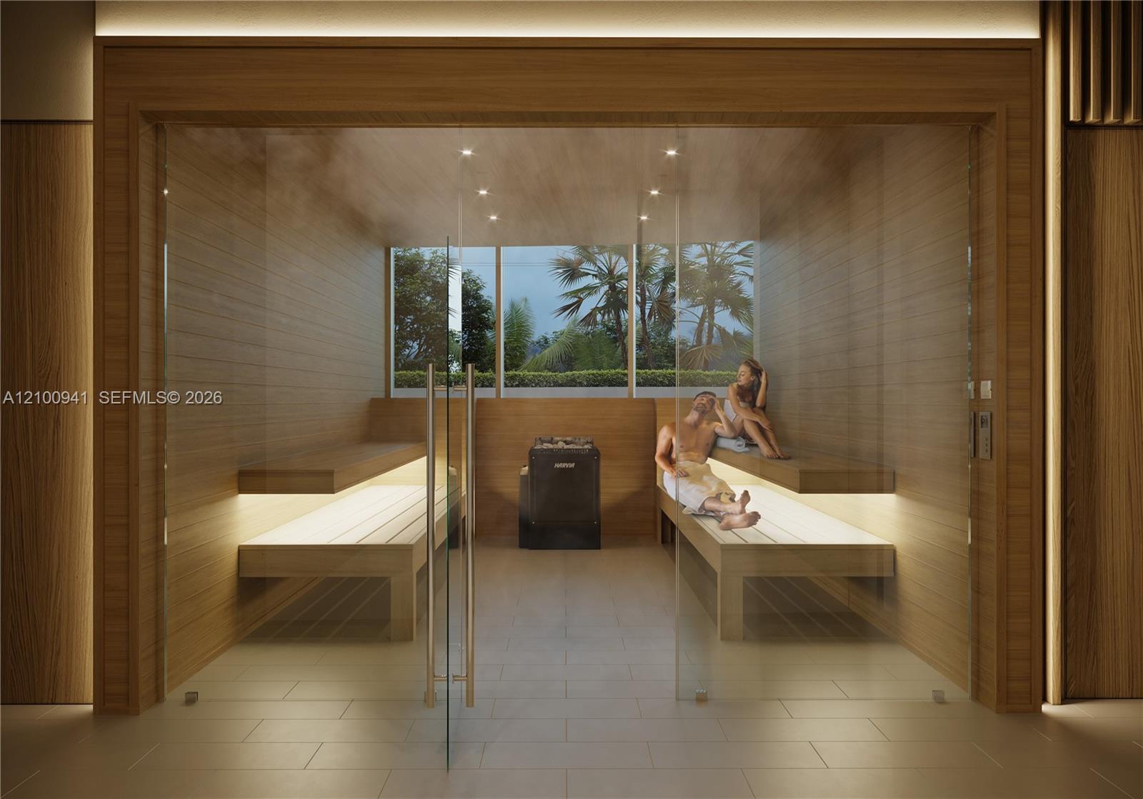 Wood-paneled sauna with glass walls, built-in benches, and a Harvia heater.