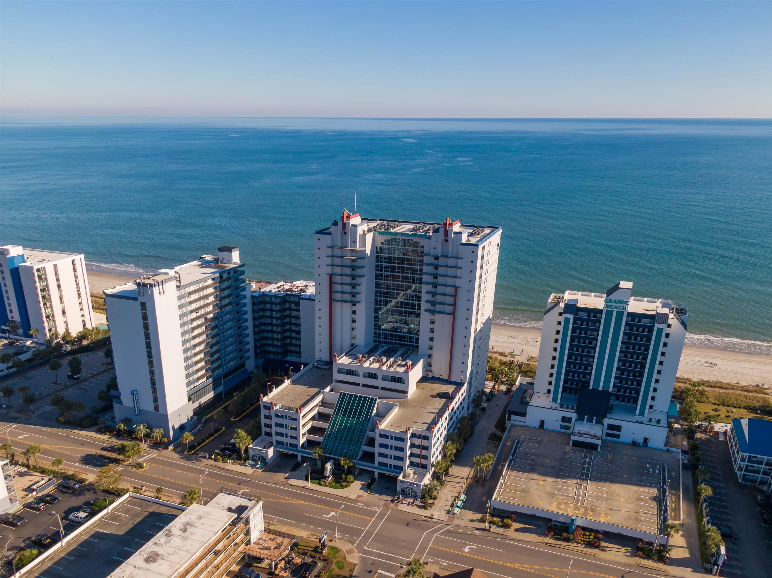 Aerial view of oceanfront condominium towers beside the beach and Atlantic Ocean.