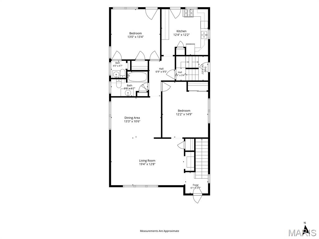 Floor plan showing two bedrooms, two baths, kitchen, dining area, living room, foyer, and staircase.