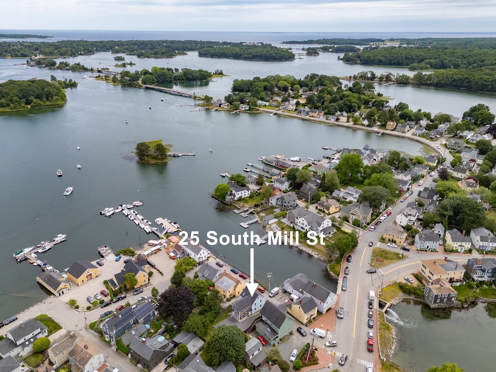 Aerial view of a waterfront neighborhood, with 25 South Mill Street marked by an arrow.