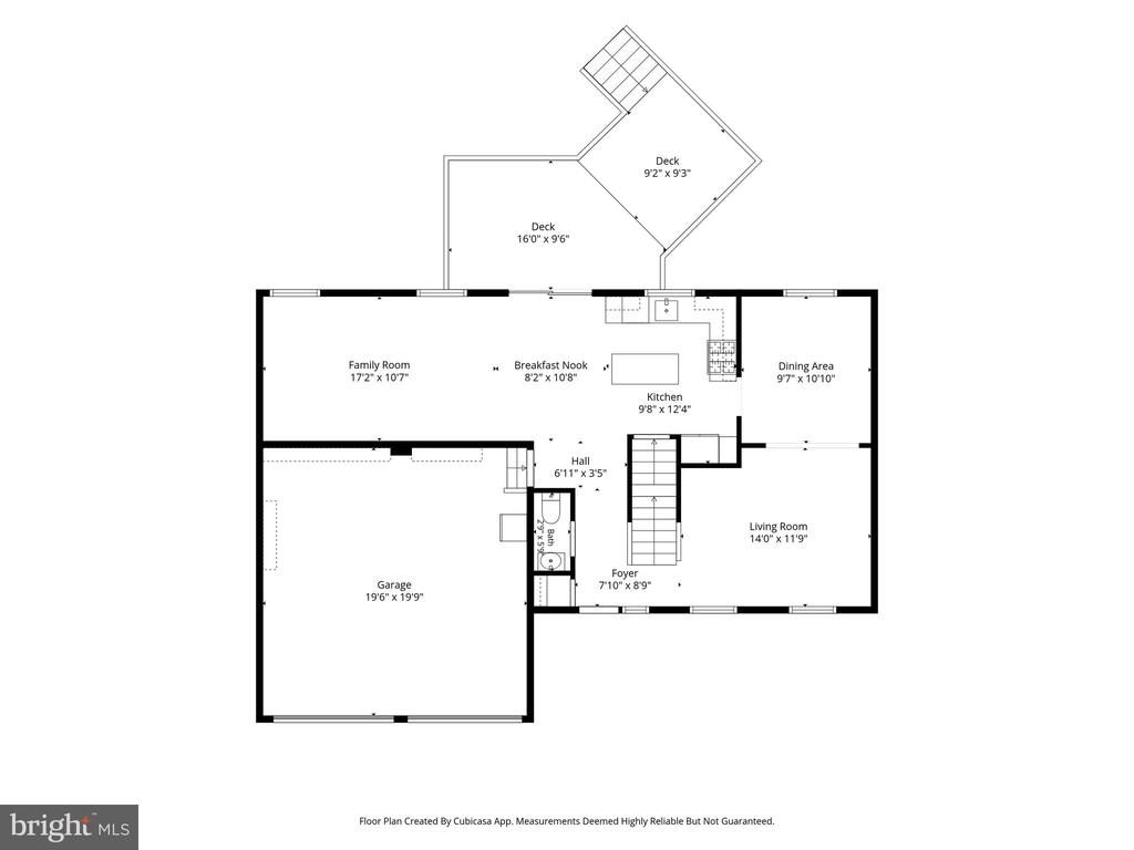 Floor plan showing a garage, living and family rooms, kitchen, dining area, bath, and two decks.