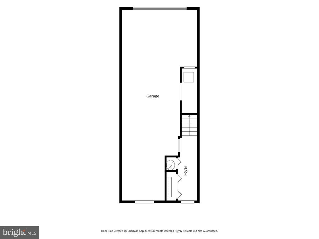 Floor plan showing a garage, stairs, and foyer.