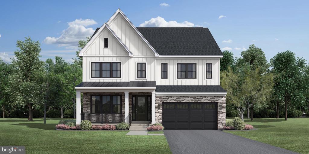 Two-story white farmhouse with a stone lower facade, covered porch, and attached two-car garage.