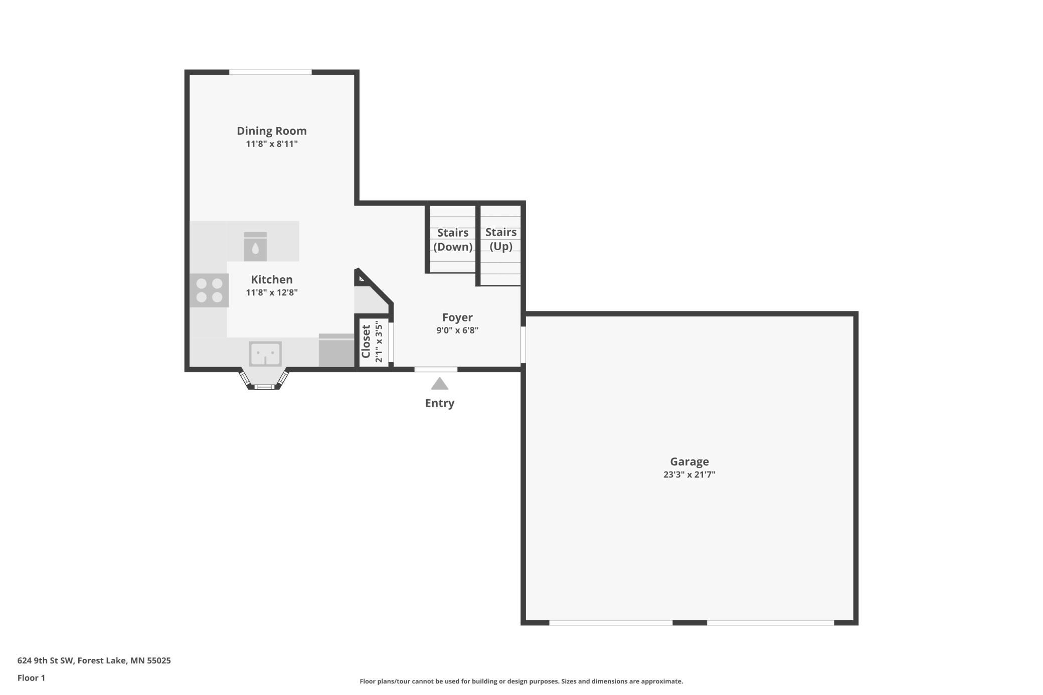 First-floor plan with kitchen, dining room, foyer, stairs, and attached garage.