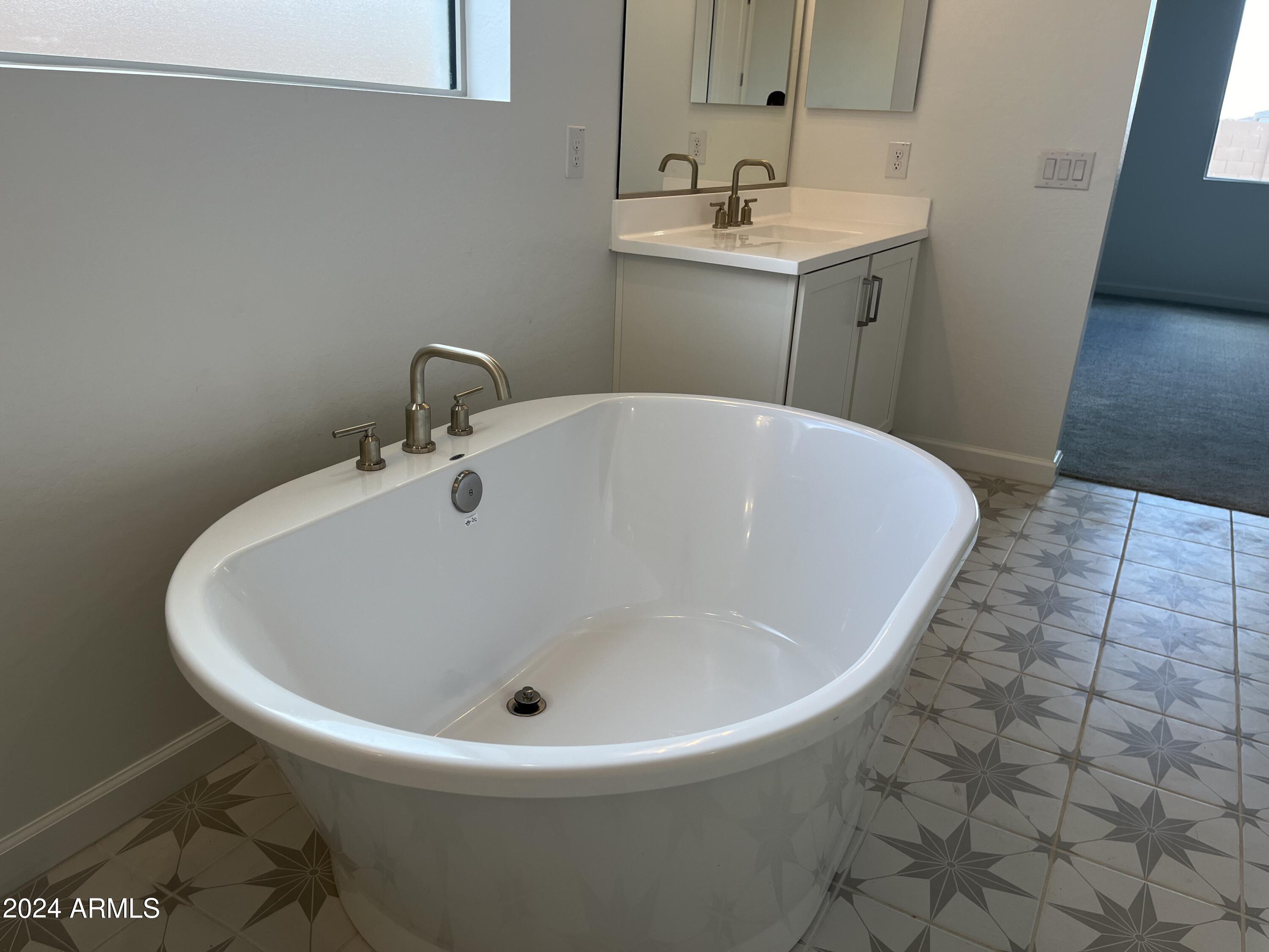 7699 W TETHER Trail