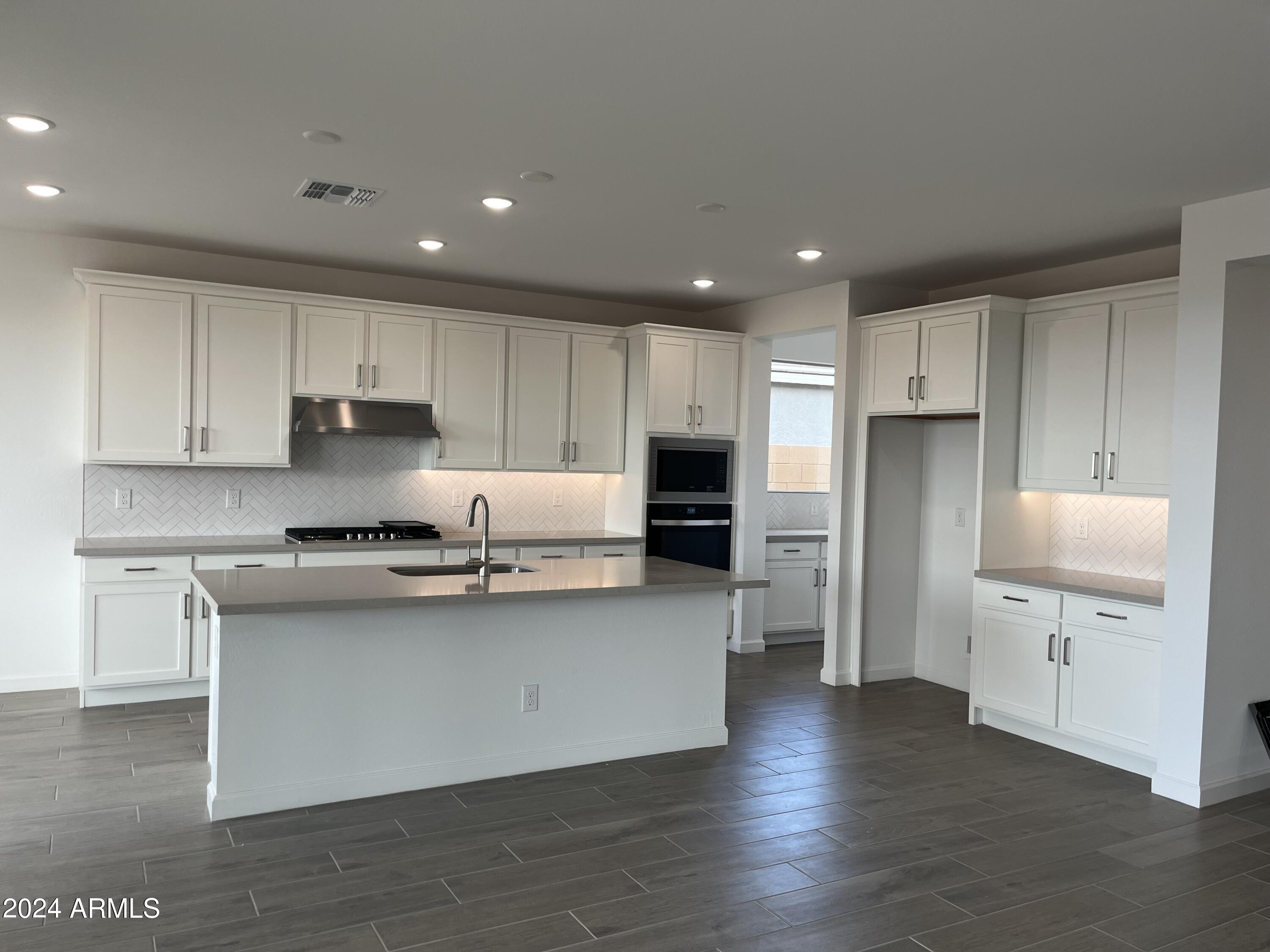 7699 W TETHER Trail