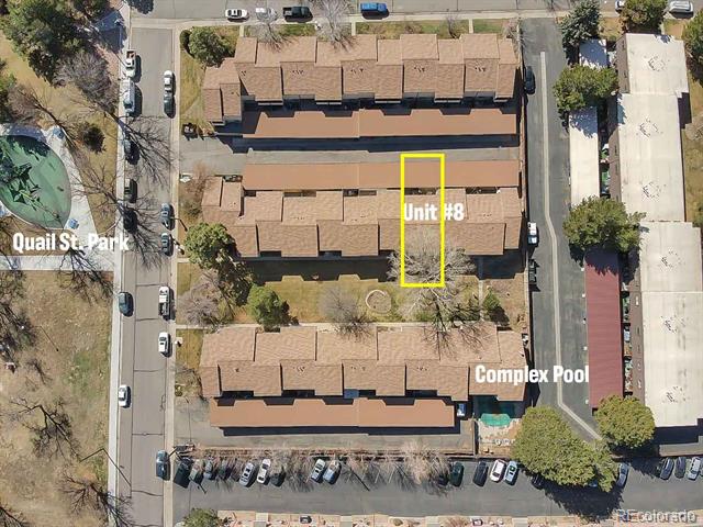 Aerial view of condo complex with Unit 8 outlined beside Quail Street Park and pool.