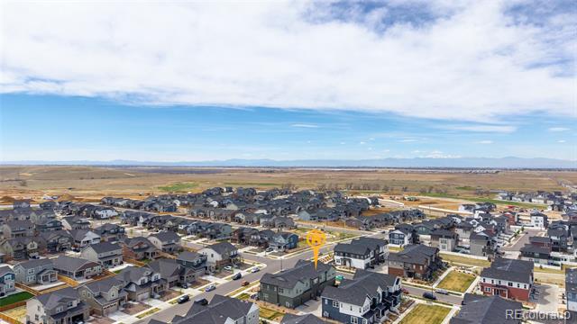Aerial neighborhood view with the featured home marked by a yellow pin.