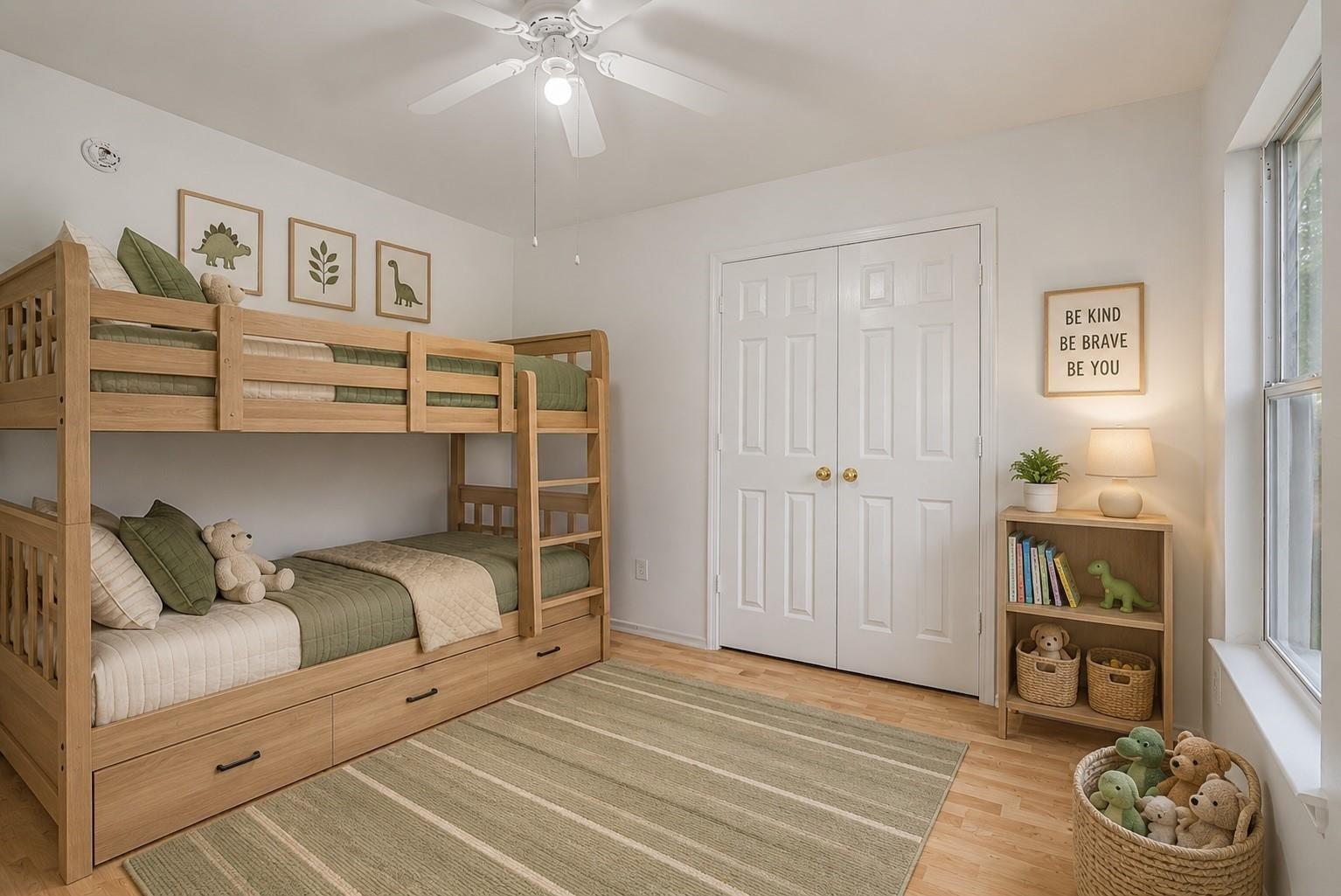 Bedroom with a light wood bunk bed, green bedding, and a toy-filled basket beside the window.