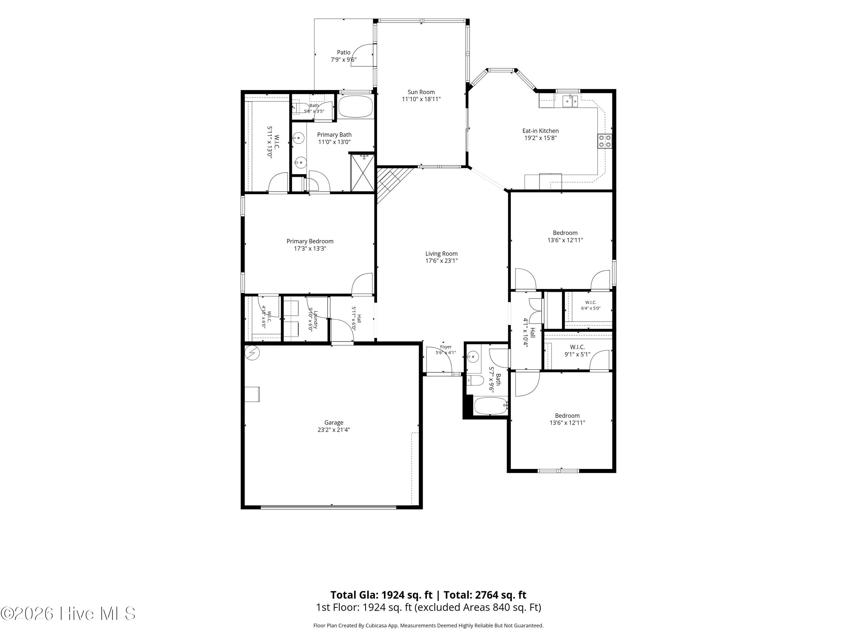 First-floor plan showing three bedrooms, a sun room, eat-in kitchen, patio, and garage.