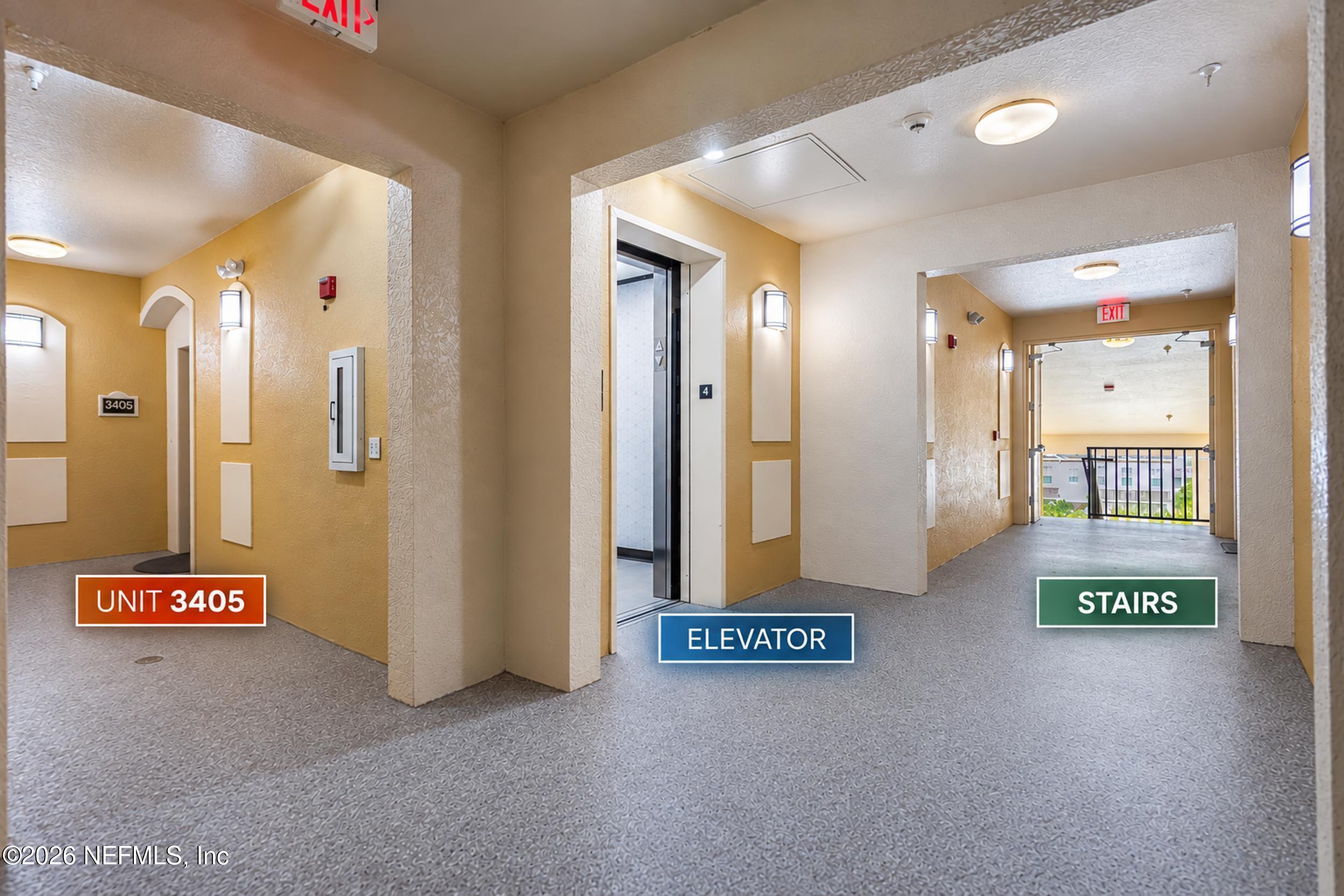 Condominium hallway showing unit 3405, an elevator, and the stairs.