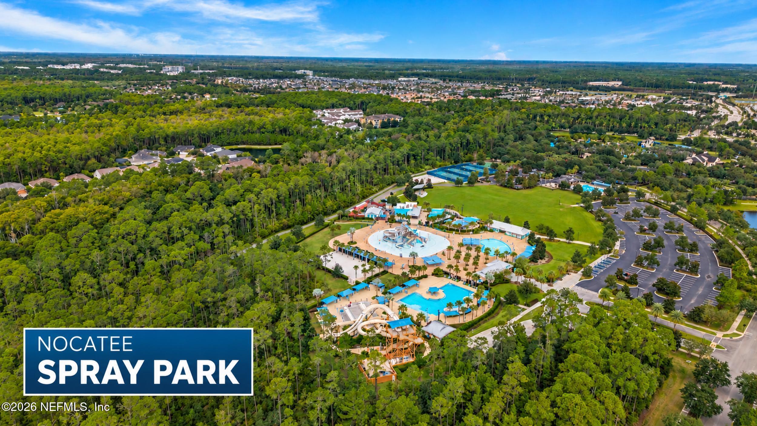 Aerial view of Nocatee Spray Park with pools, water slides, and surrounding greenery.
