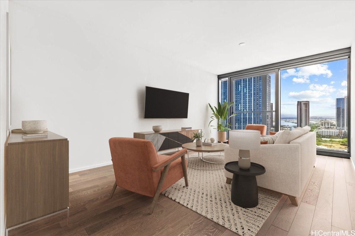 Staged living room with floor-to-ceiling windows overlooking Honolulu’s skyline.