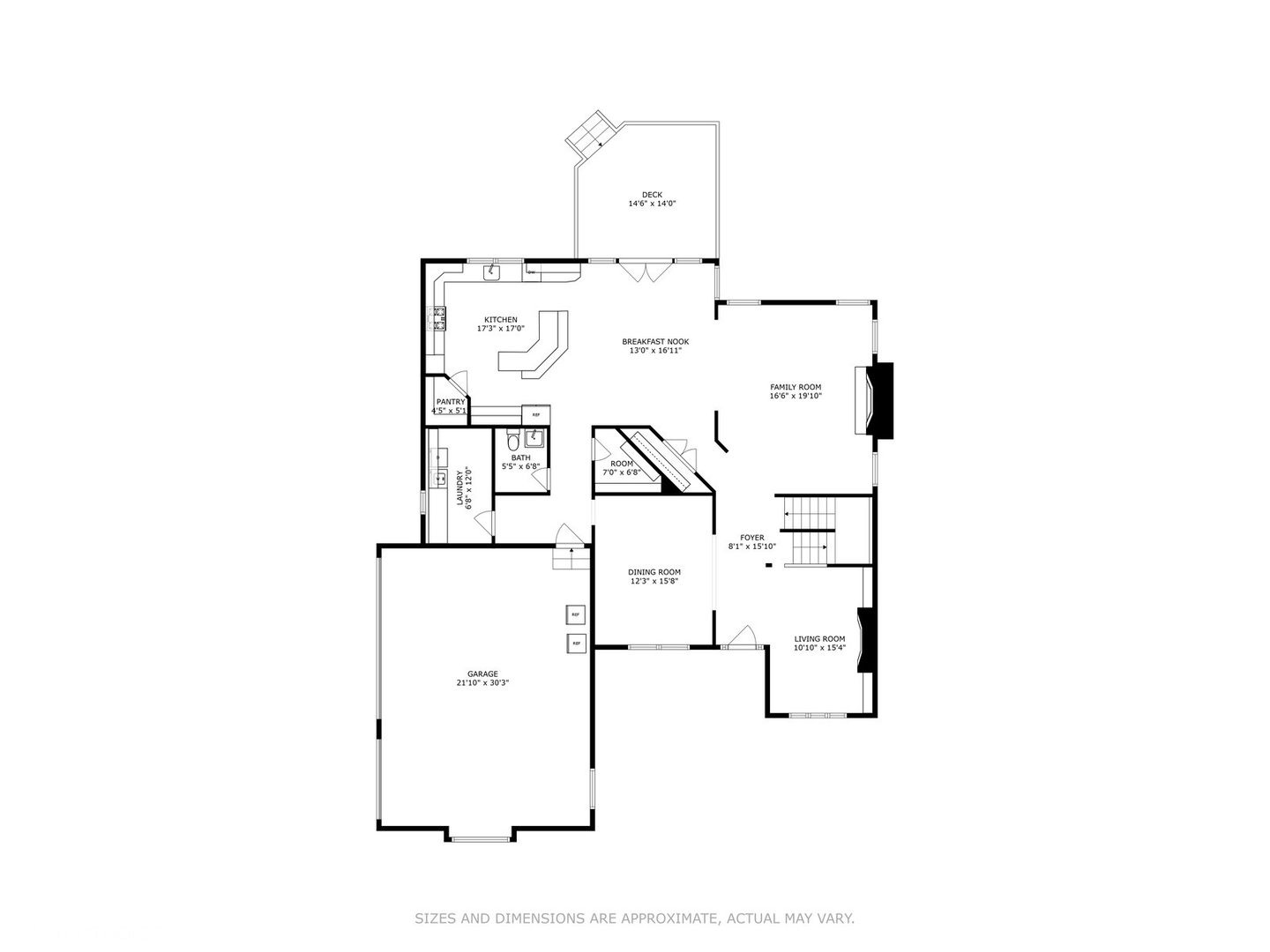 First-floor plan showing the kitchen, family room, dining and living rooms, garage, and rear deck.