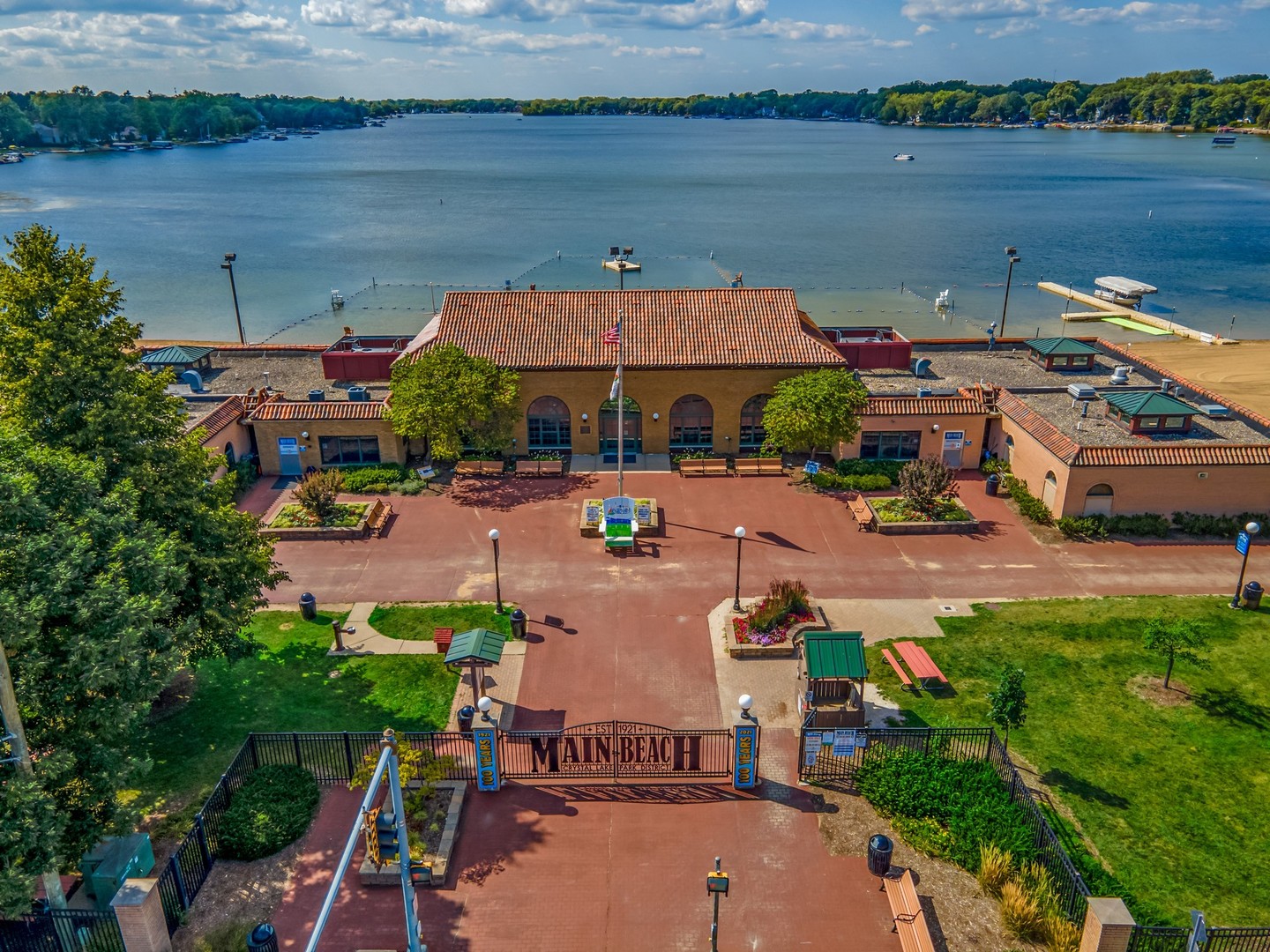 Aerial view of Main Beach in Crystal Lake, with its lakefront pavilion and swimming area.