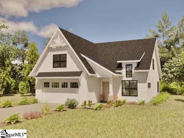 White two-story farmhouse with dark gabled roofs, a front garage, and landscaped garden beds.