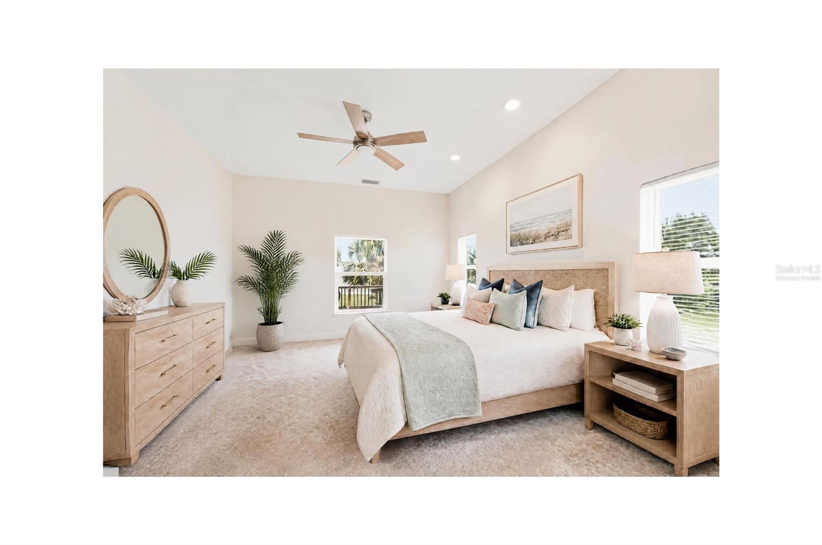 Staged bedroom with a large neutral-toned bed, woven headboard, and light wood furnishings.