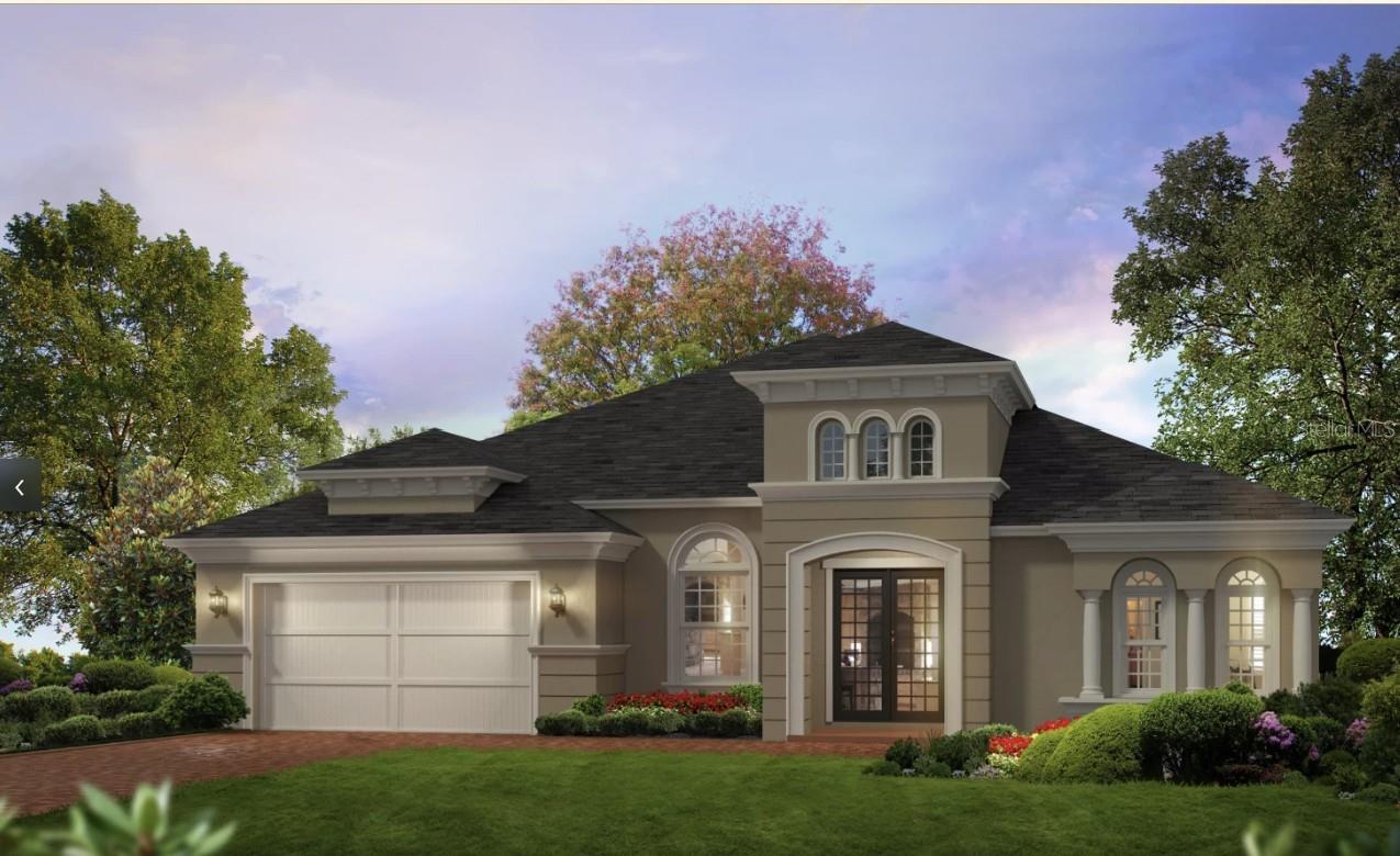 Large taupe house with arched windows, a double garage, and landscaped front lawn.
