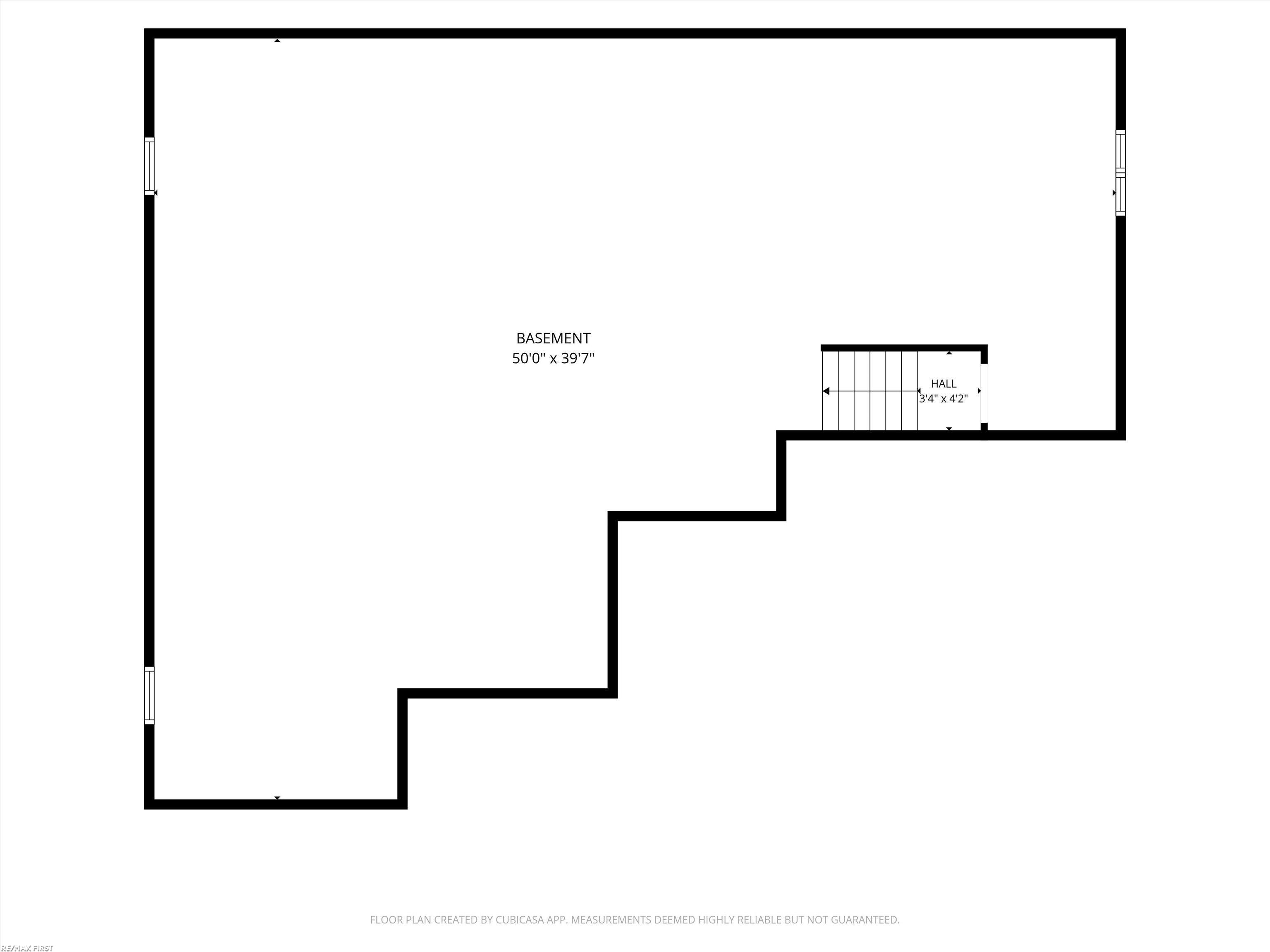 Basement floor plan with an irregular open area and a stair hall.