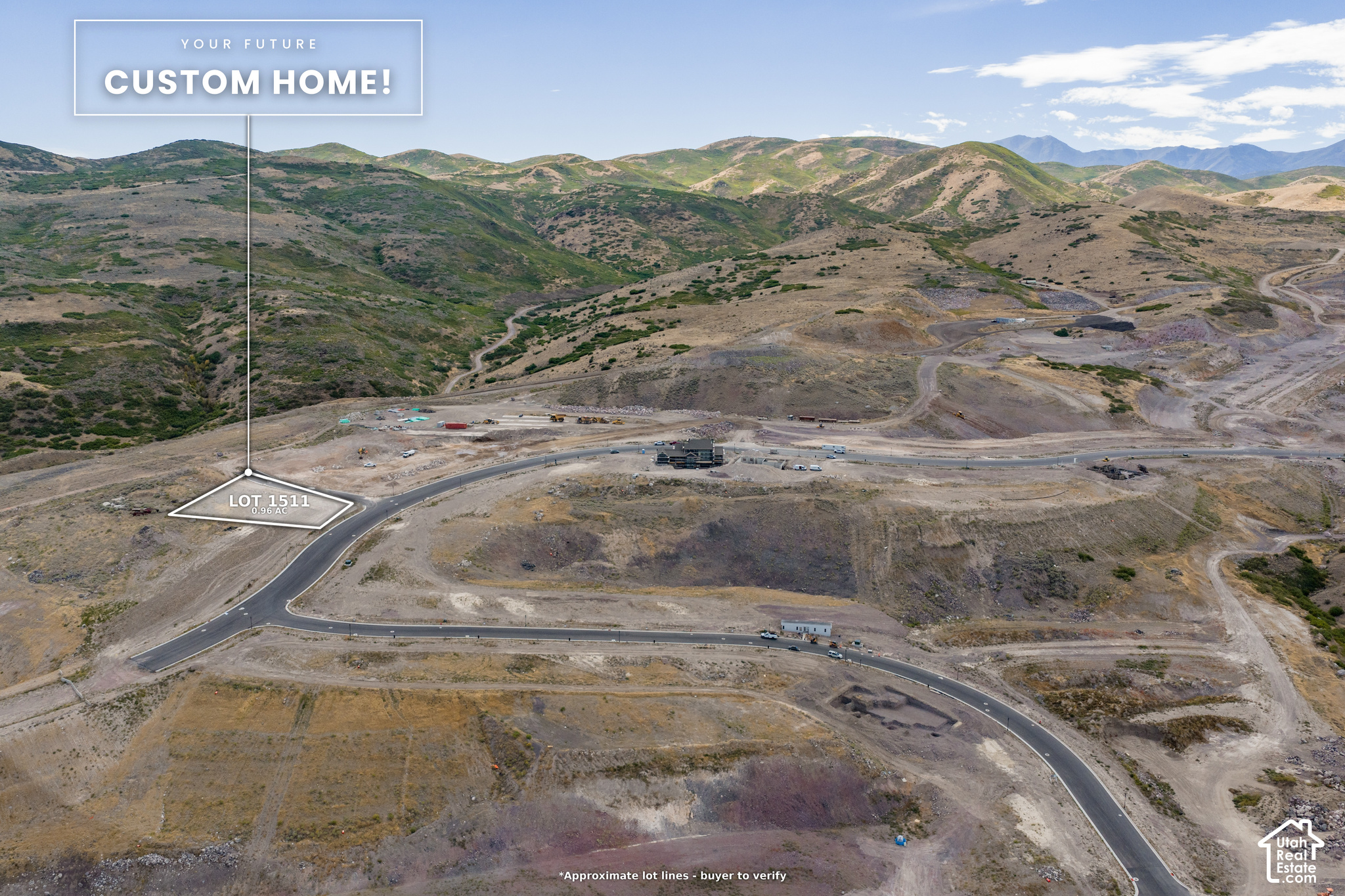 Vacant 0.96-acre lot outlined beside a new road, with mountain foothills behind it.