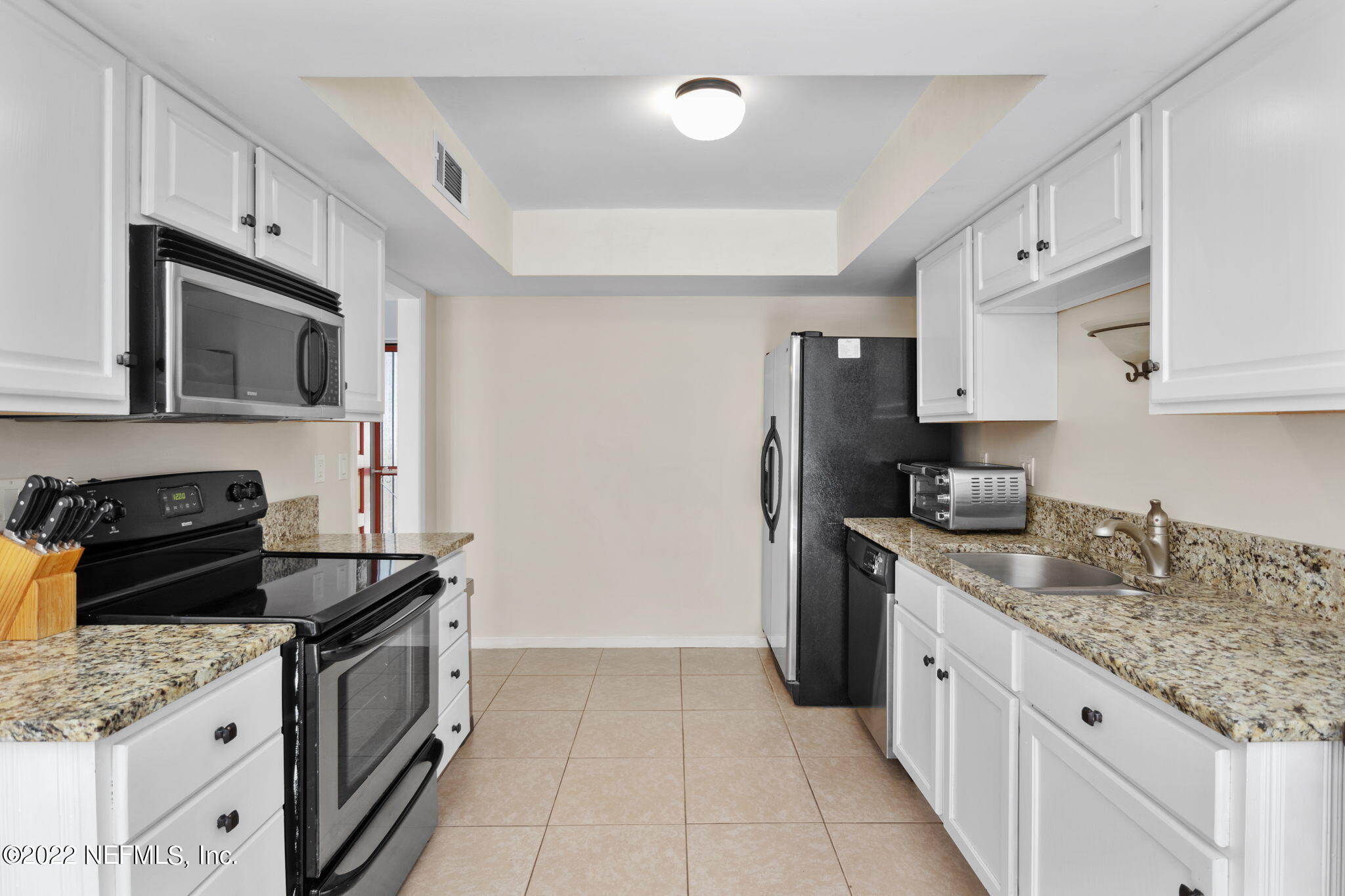 9893 SAWGRASS DR E