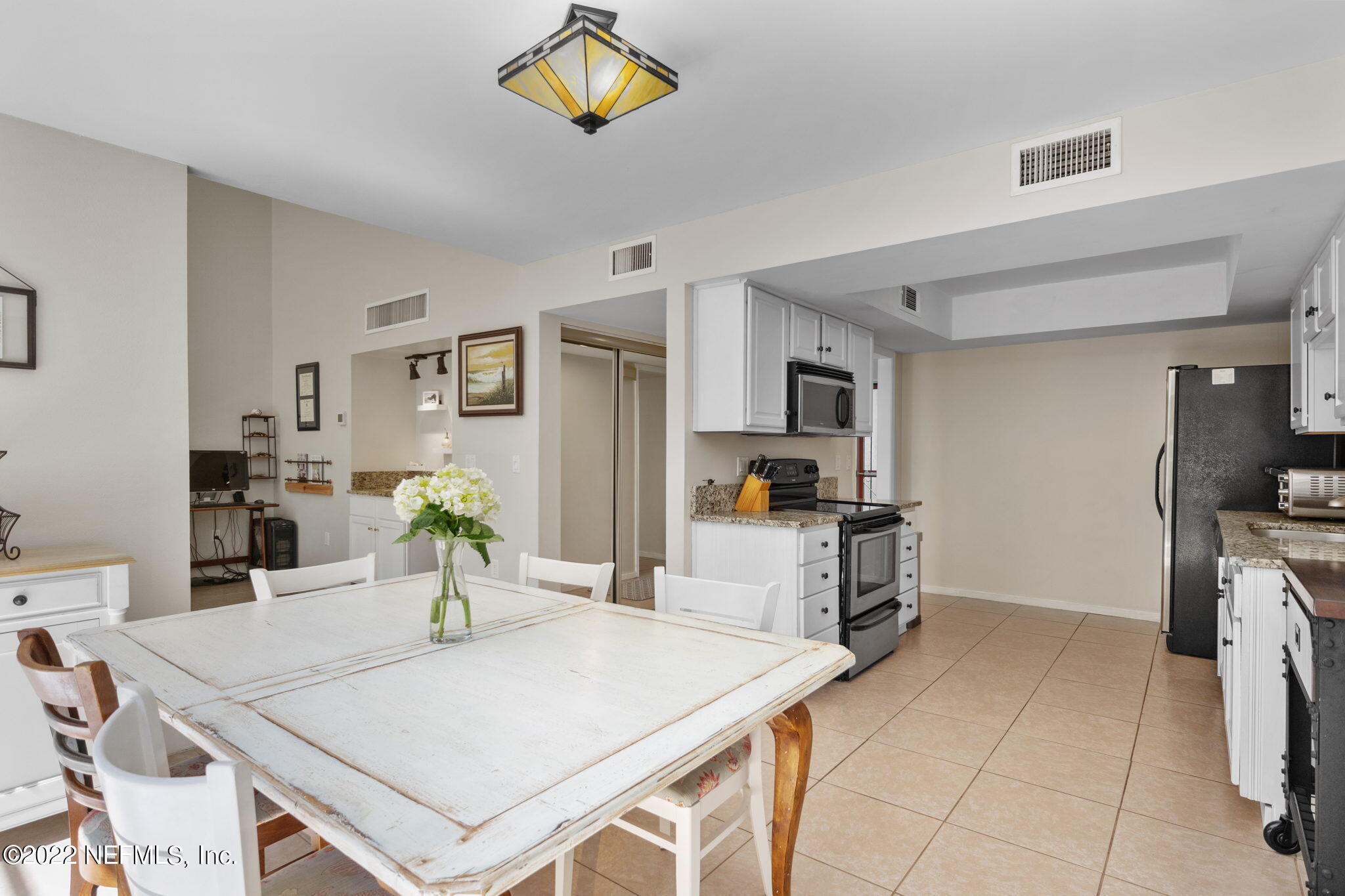 9893 SAWGRASS DR E