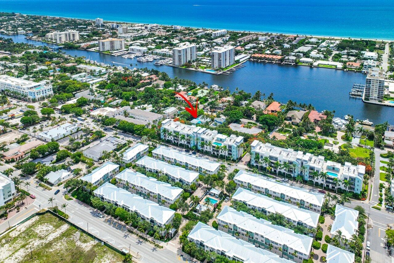 Aerial view of 300 SE 7th Avenue marked by a red arrow, between the Intracoastal Waterway and ocean.