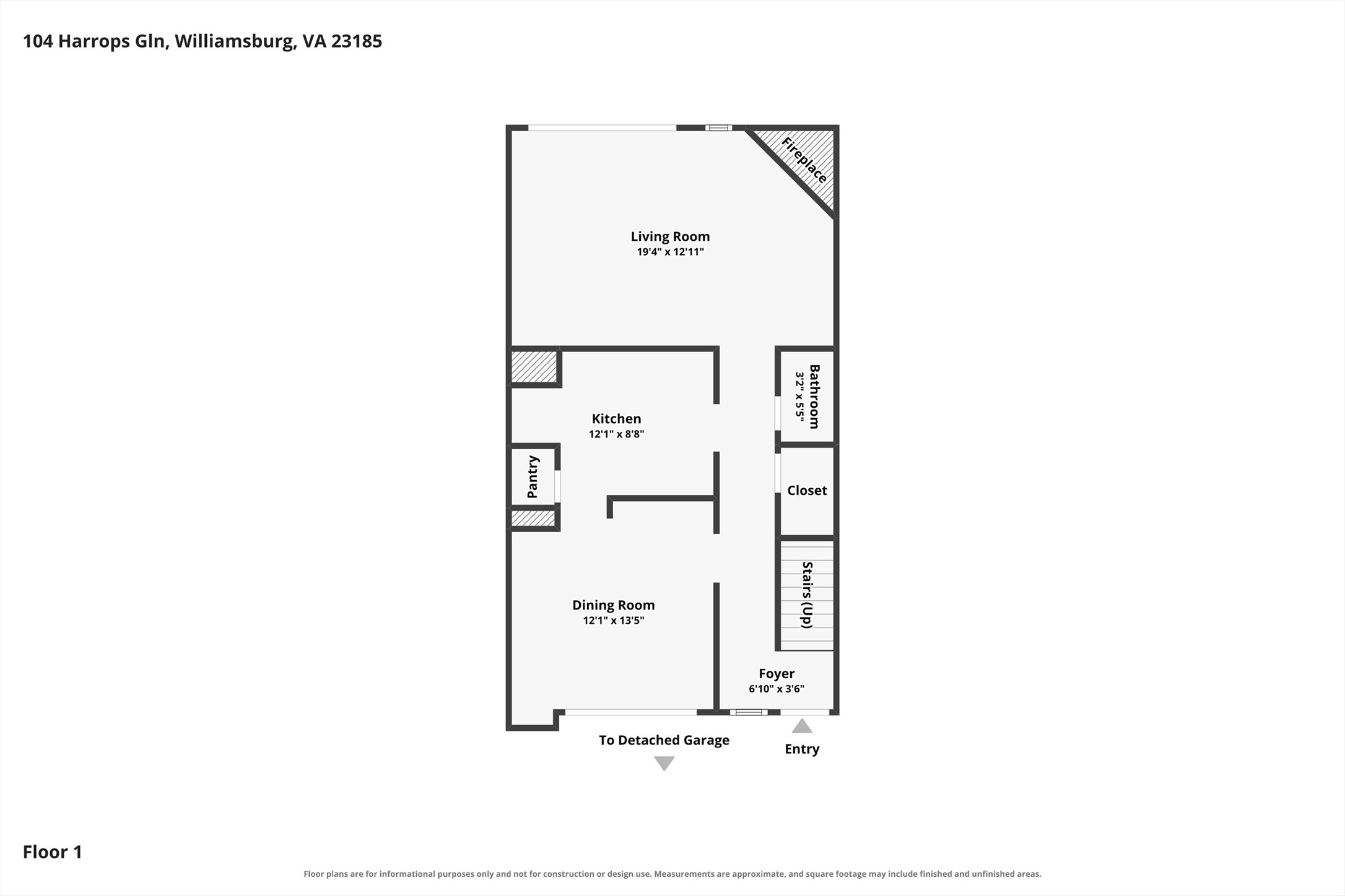 First-floor plan showing the living room, kitchen, dining room, and entry to a detached garage.